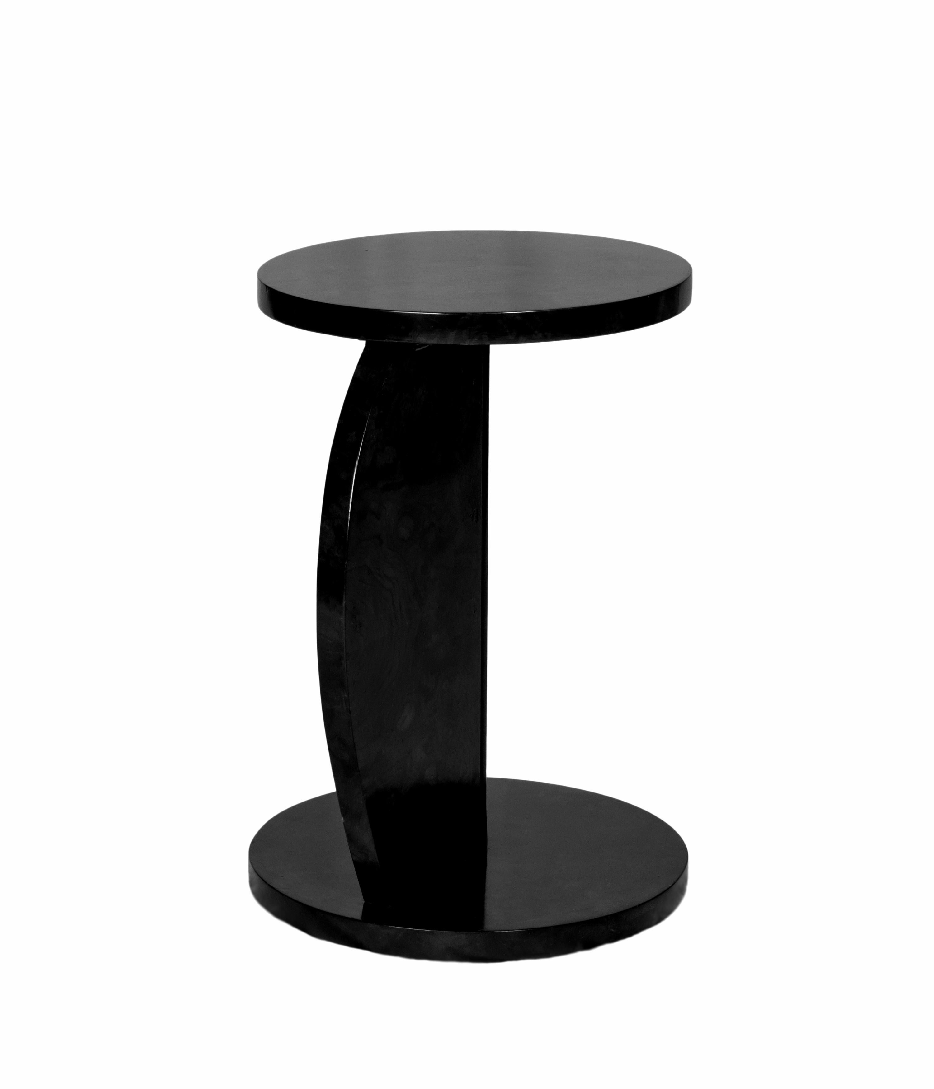 This Art Deco C-Shaped Black Lacquer Side Table design, expertly crafted in walnut. 
It has an elegant and rare design, with two smooth circular trays, one placed atop the other, supported by a C-shaped arched base.
This piece is ideal for