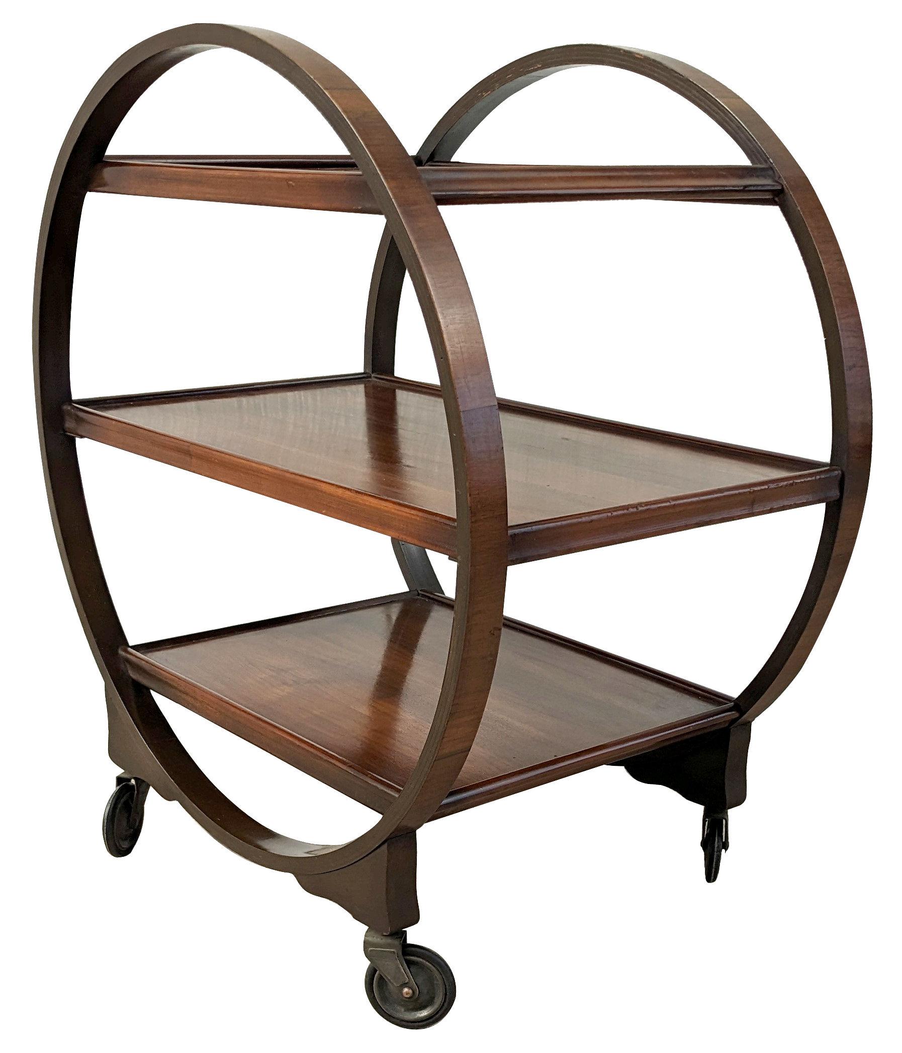 Very attractive and iconic English Art Deco Savoy Hostess trolley cart dating from the 1920s-1930s period. This three-tiered trolley not only looks impressive but is very functional too. Solid walnut in a warm mid-tone coloring on it's original