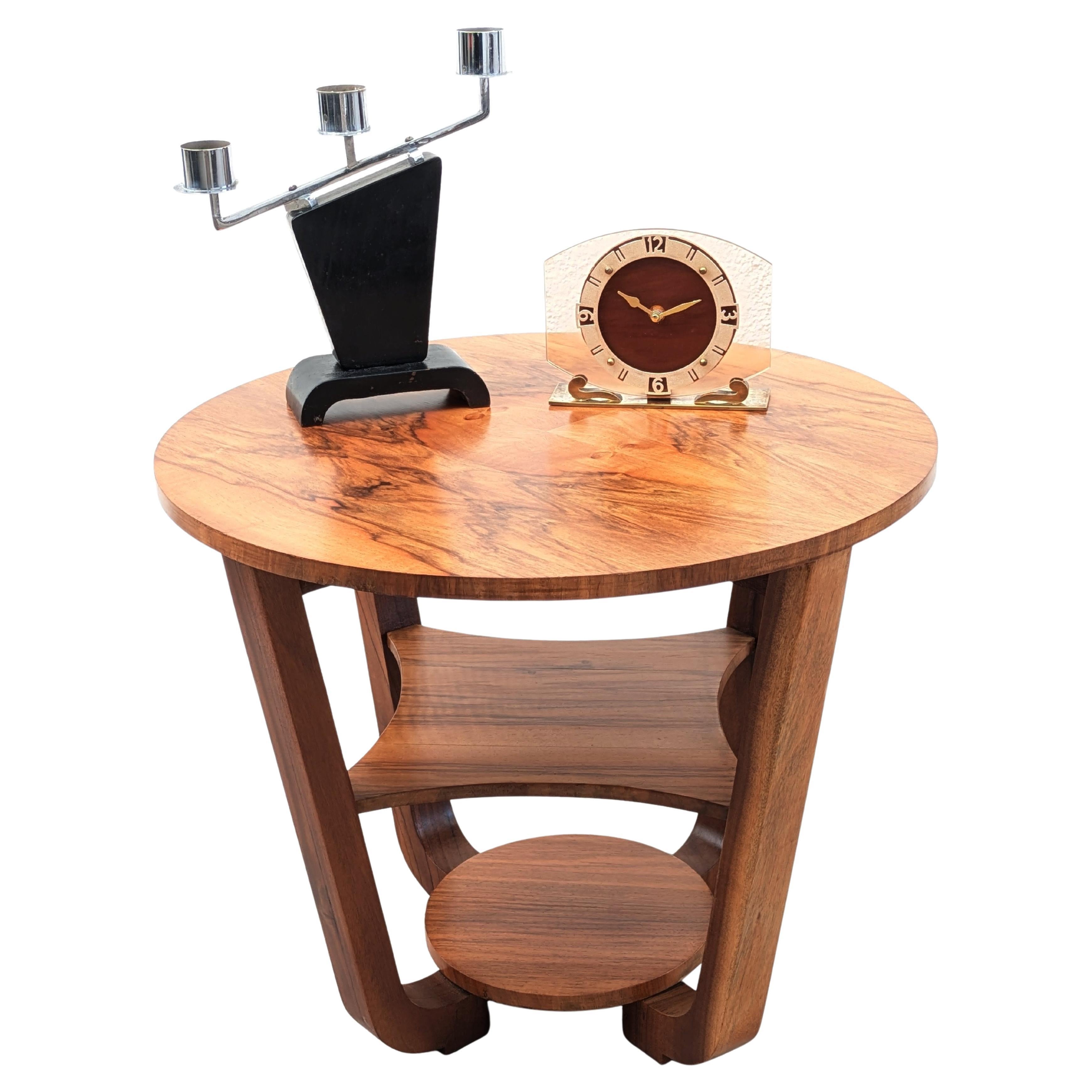 Very Stylish 1930's highly figured walnut Modernist coffee/ side table in superb showroom condition having been recently professionally restored. This is a superb period example which has four curved leg supports which meet to a circular base.