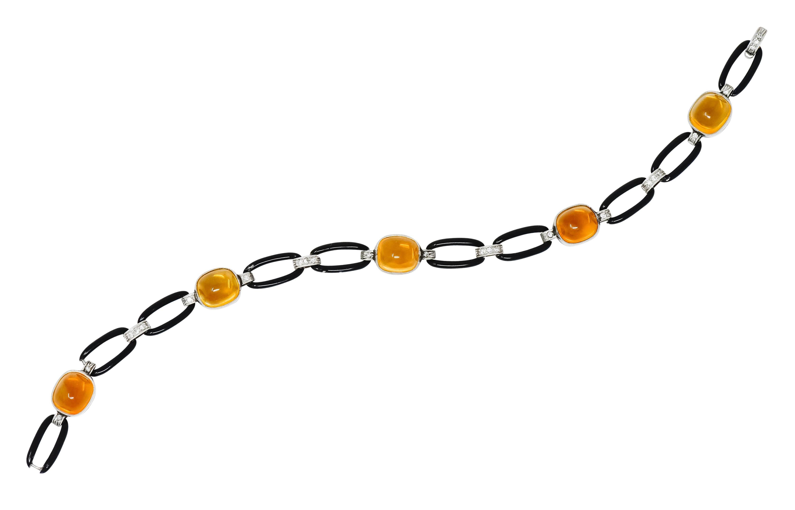 Link style bracelet comprised of elongated oval links glossed with black enamel exhibiting some loss; consistent with age, wear, and use

Alternating with platinum milgrain spacer links accented by single cut diamonds weighing in total 0.22 carat,