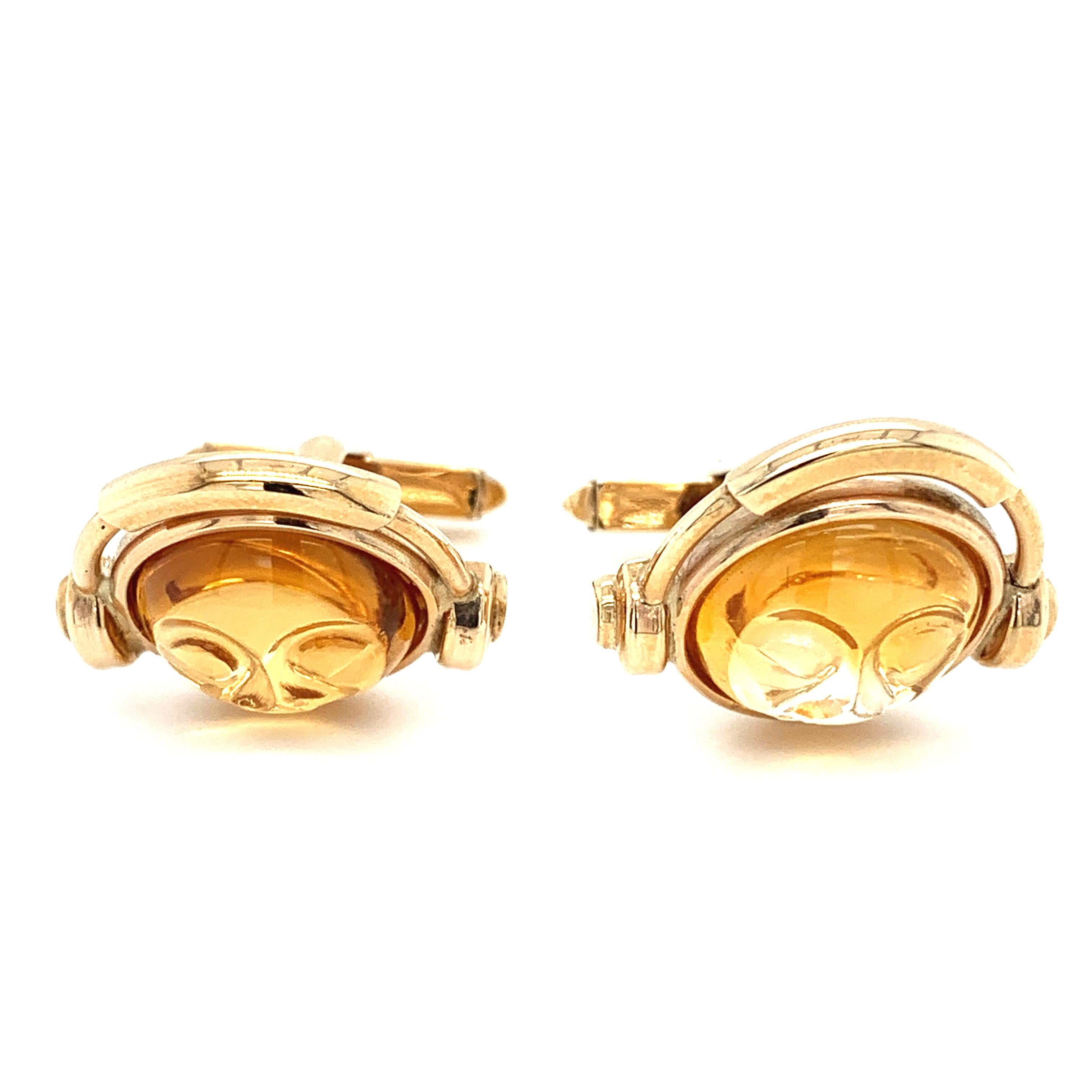 Art deco citrine gemstone gents cufflinks 9ct yellow gold.
Composed of natural citrine gemstone carved DJ shaped head design all mounted in 9ct yellow gold.
Citrine total gemstone weight 15.00ct natural carved citrine DJ head shaped.
Large citrine