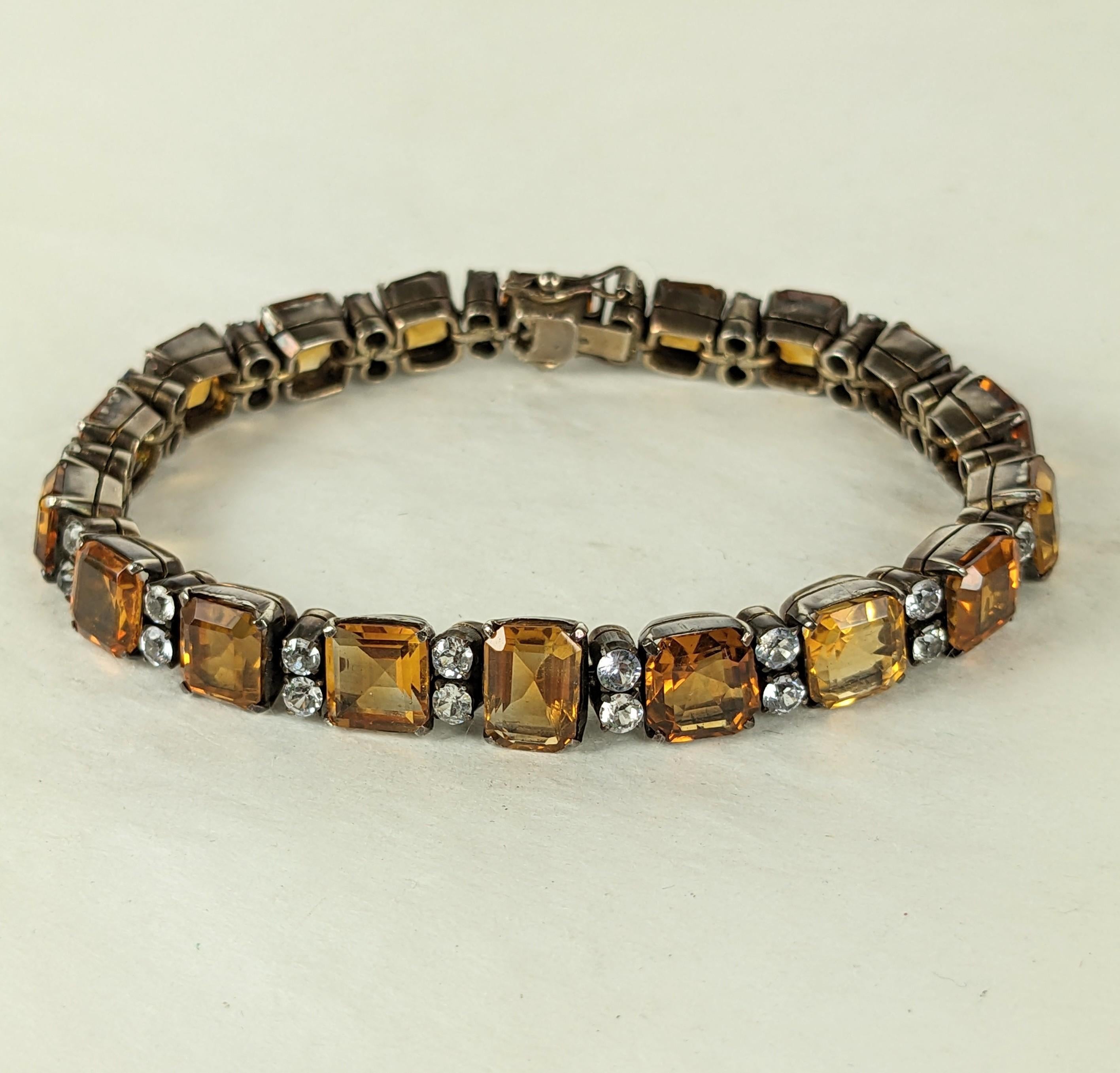 Attractive Art Deco Citrine Line Bracelet spaced with white zircons set in sterling vermeil. Unusual bracelet with multisized citrine gemstones with slight tonal variations and cuts. Most bracelets from this period are set with citrine pastes