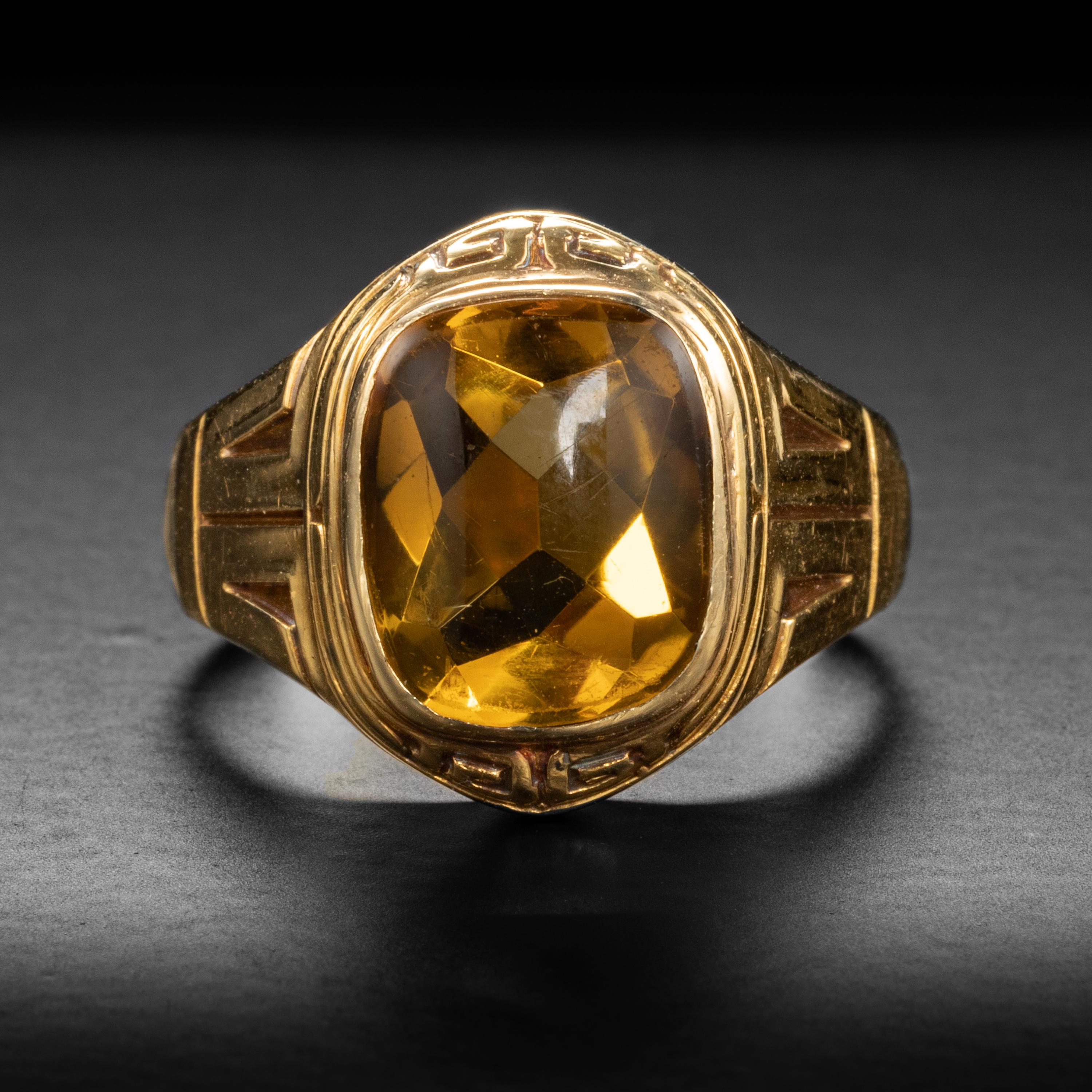 This men's citrine ring was created by hand in the Aret Deco era from 14K yellow gold.

Time has rendered the 14k yellow gold band butter-smooth. And has also favored the gloriously warm natural citrine gem. The rectangular-cut stone is faceted