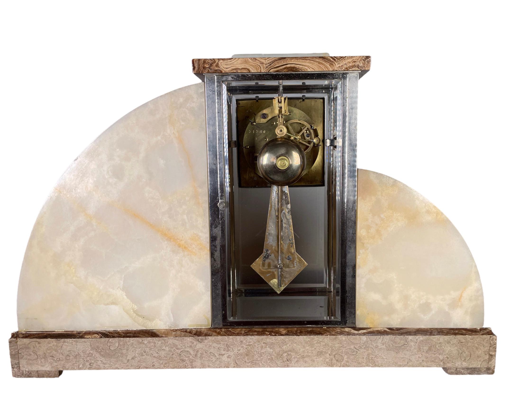 A marble French Art Deco Clock, by the highly regarded Sculptor Demetre Chipurus (unsigned). Other examples of these signed figures exist, as shown in some of the images. 
Two young girls, hold each other as they peer cautiously at a marabou bird.