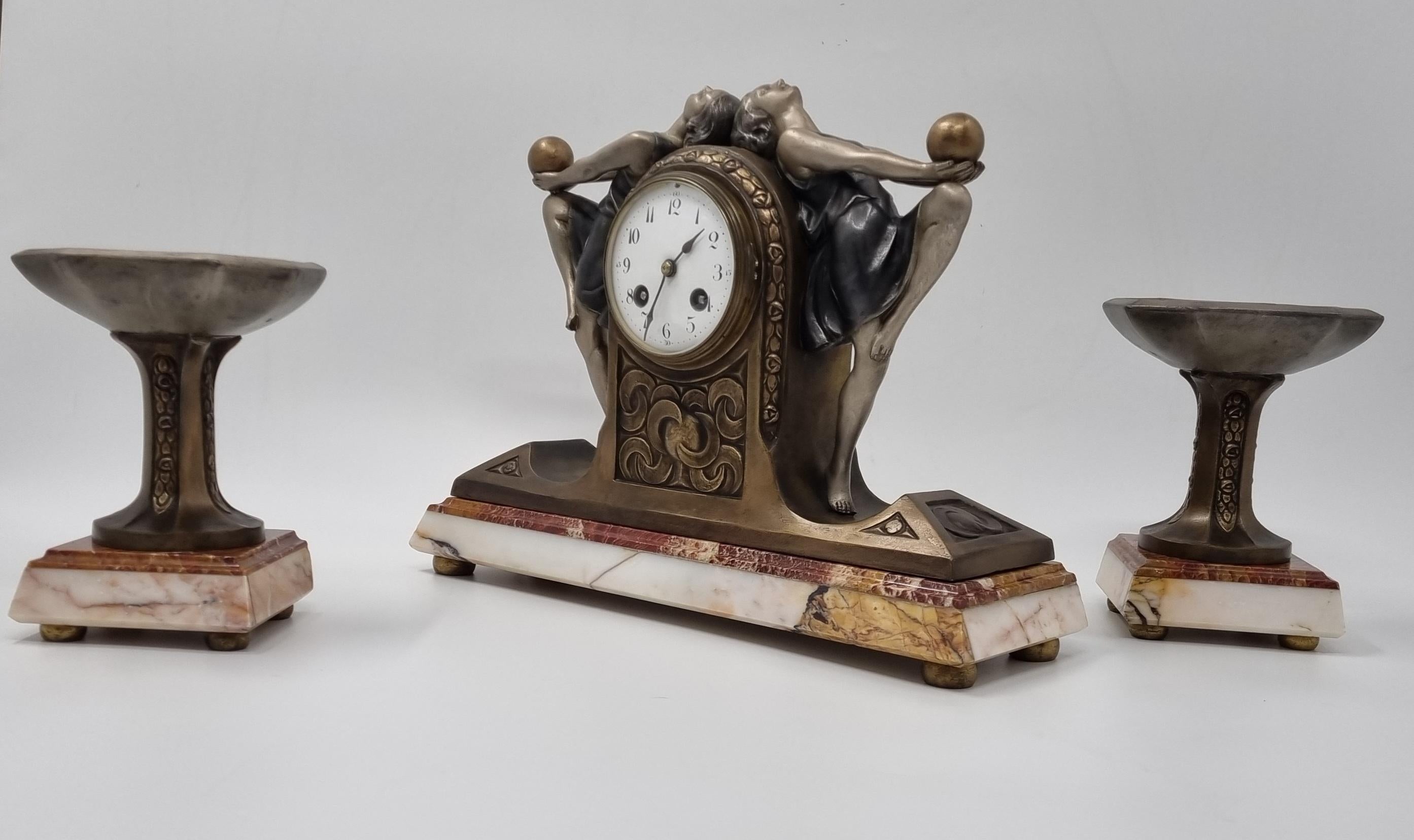 Cast Art Deco Clock Garniture Set with Two Ball Dancers by P. Sega For Sale