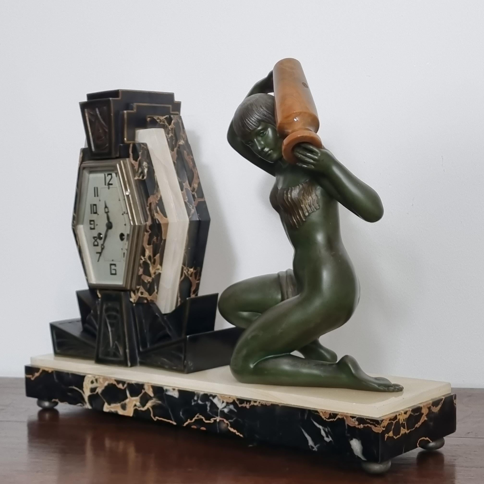 Spelter Art Deco Clock with Lamp - Water Carrier Sculpture / Illuminated Nude with Vase For Sale