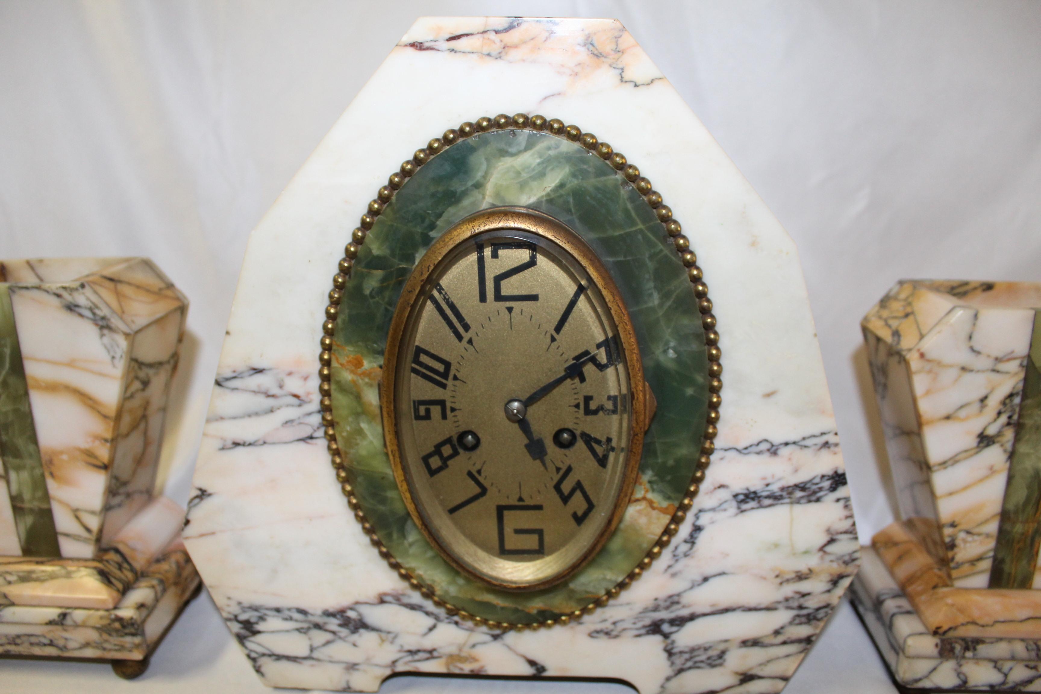 A good size Art Deco clock set with the two side holders. Good color of marble with a Green Onyx hi-light.