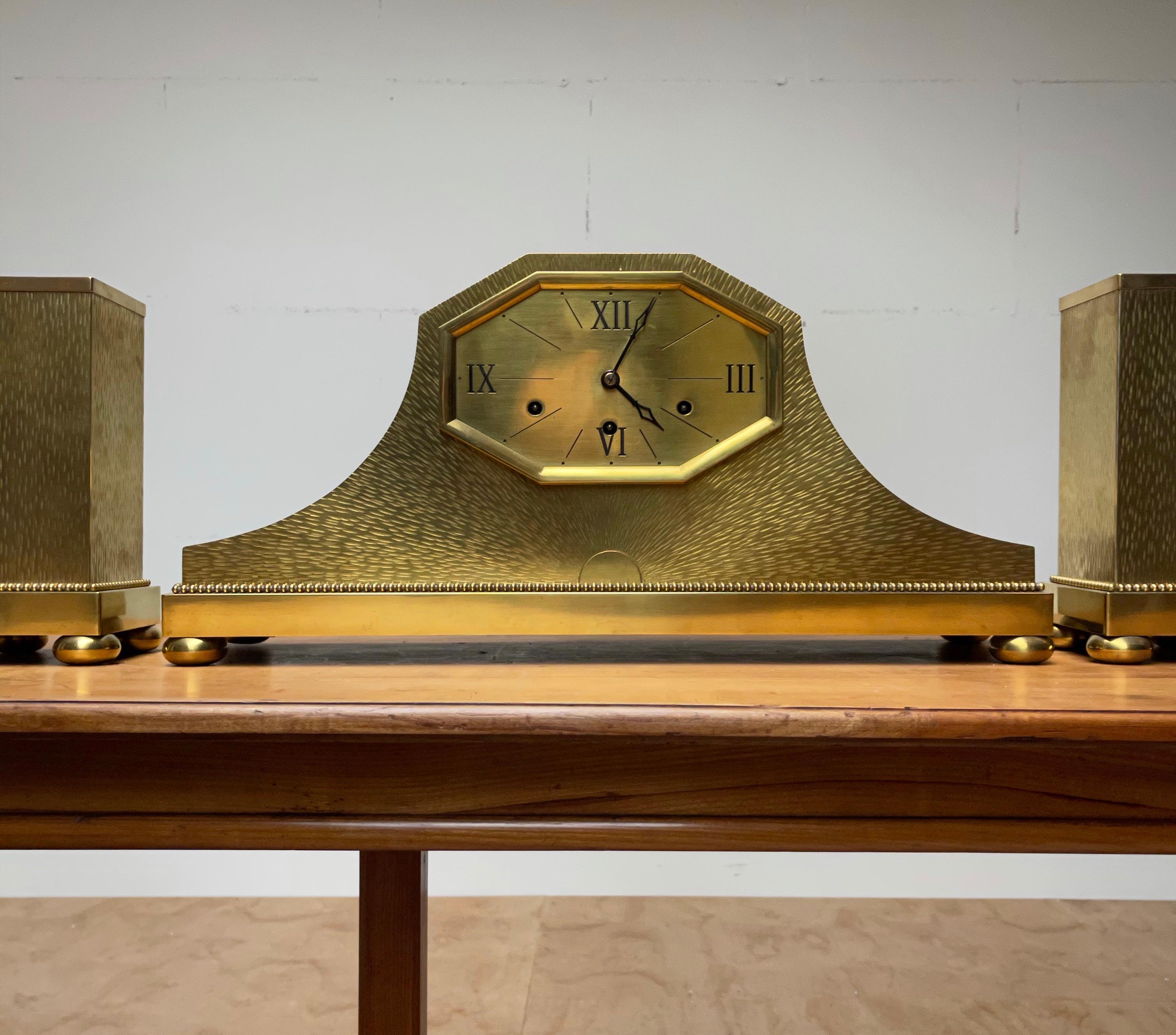 Interesting and very attractive Art Deco mantle / mantel clock, circa 1920. 

Some of the most attractive designs date from the Art Deco era and this remarkable clock set is no exception to that rule. The combination of the stunning design, the