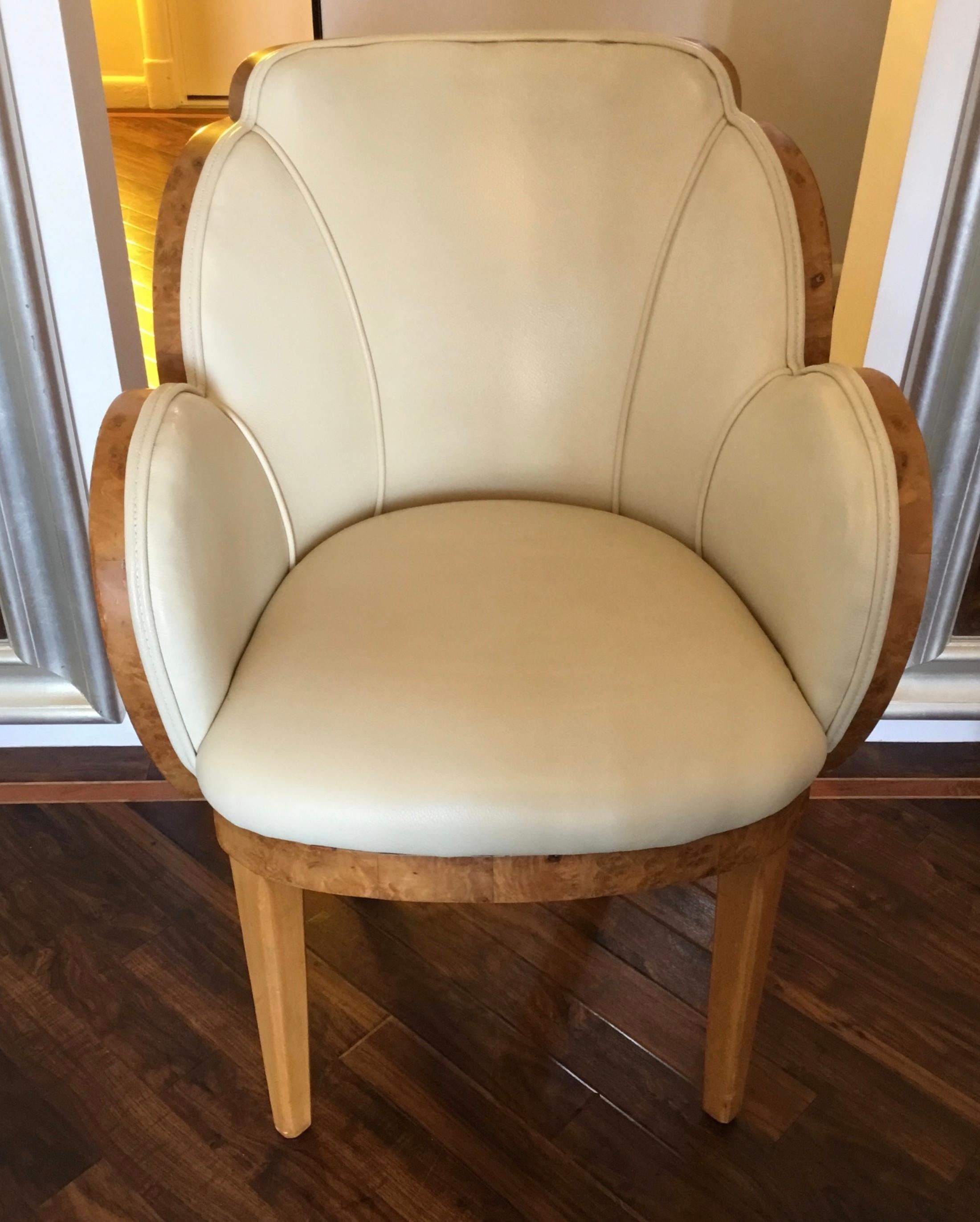 Art Deco Cloud chair by Harry and Lou Epstein. 
The sides in burr walnut and the back in a striking figured walnut. 
Upholstered in cream leather and in overall great condition.
The striking veneer detailing of this chair matches an Epstein Cloud