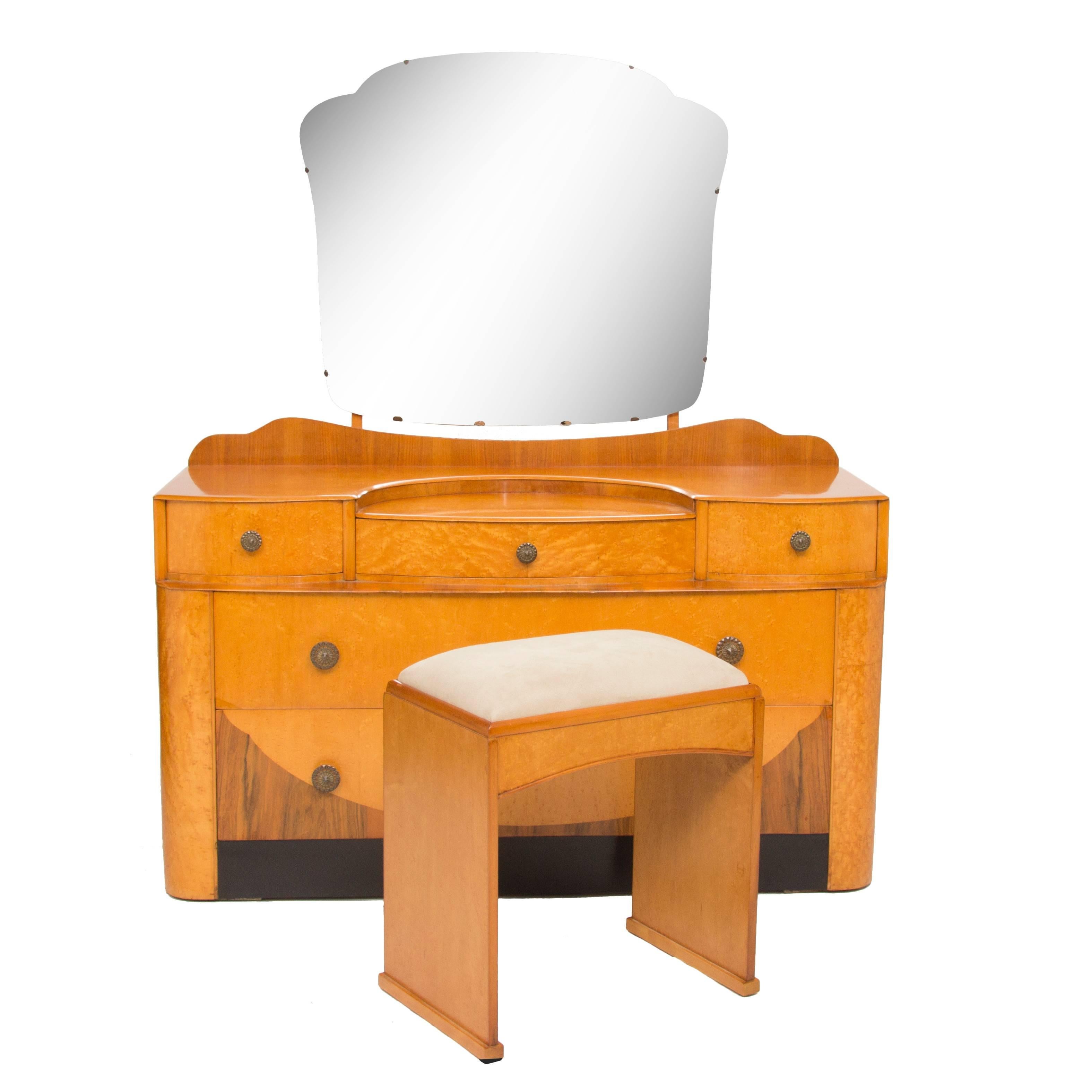 Beautiful Art Deco Cloud design dressing table and stool, finished in bird's-eye maple with walnut. 
D.Table: H 144 cm, W 125 cm, D 50 cm 
Stool: 54 cm, W 47 cm, D 32 cm.