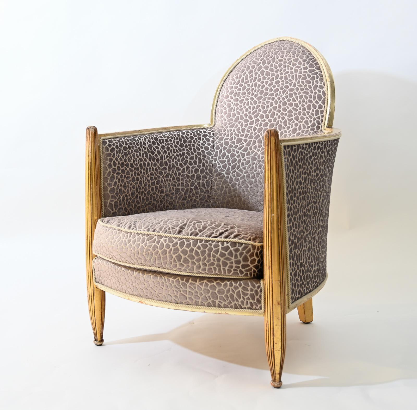 Art Deco club armchair in the Gothic style attributed to Paul Follot.

Original giltwood frame reupholstered in contemporary fabric

very faded stamp to the underside of the original linen

small sample of the original colorful fabric attached