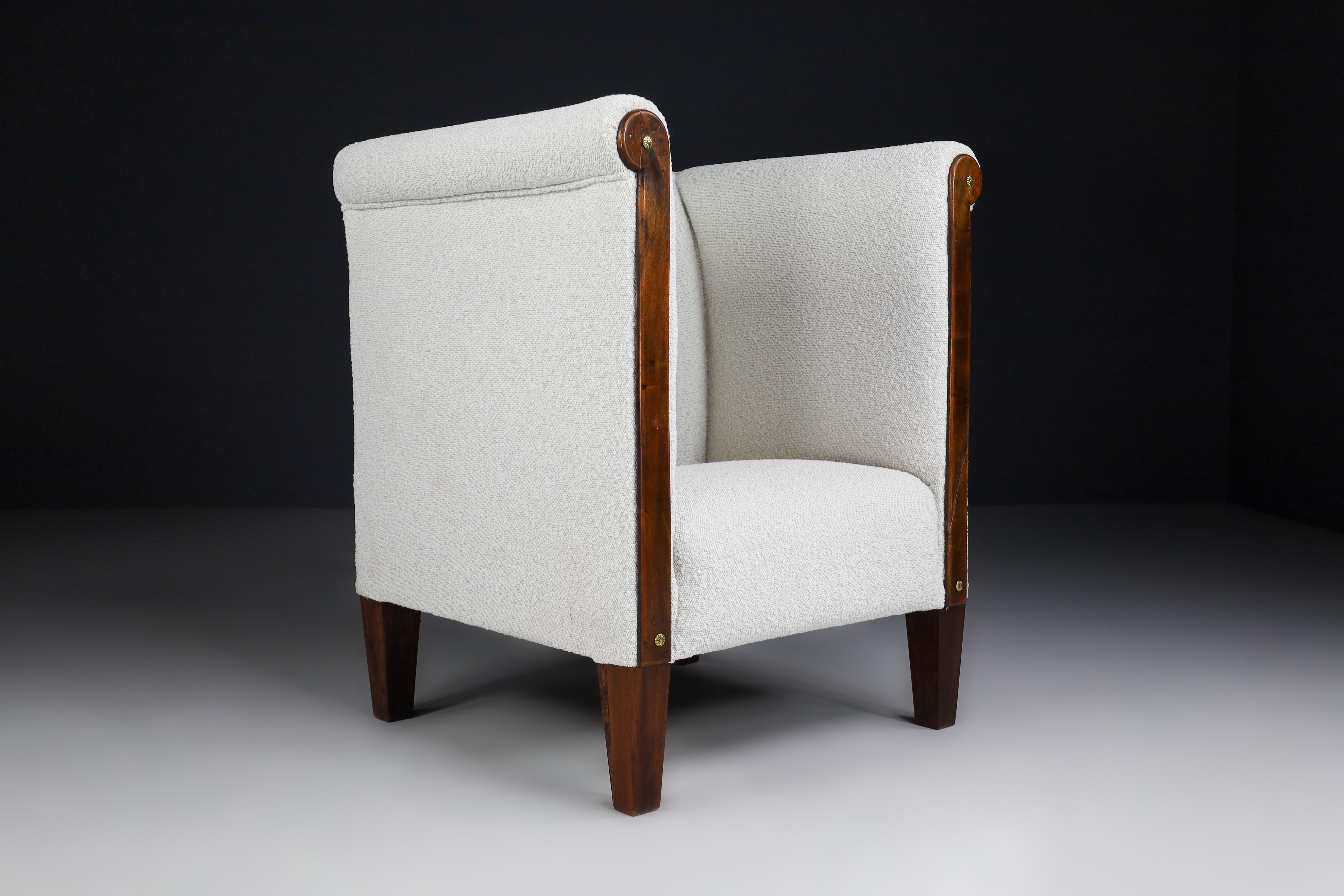 Art Deco Club chair made and designed in the 1930 in Austria, This rare model arm chair has just been reupholstered with Bouclé fabric and have nice tapered wood legs. It is in perfect vintage condition, minor patina on wood parts. This amazing club