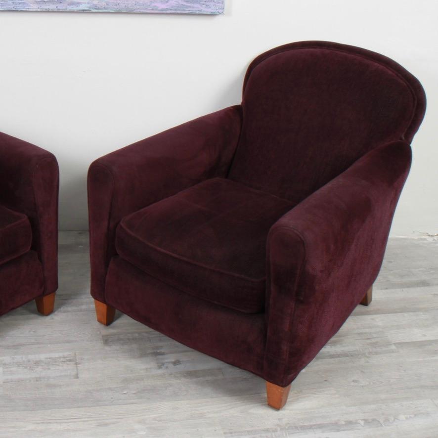 Great clean pair of Art Deco-inspired low club chairs in an eggplant chenille. Both chairs come with clean matching arm protectors. 

Long a go to manufacturer for the interior design crowd, Lee Industries has been handcrafting American made
