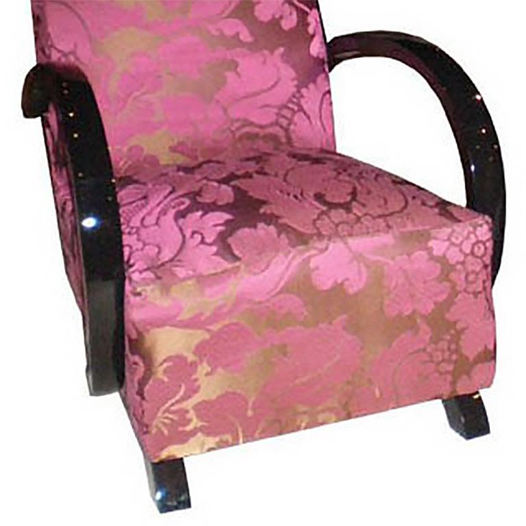 French Art Deco pair of club chairs with black lacquered trim and new pink and brown floral upholstery.
The seat height is 15”, Back height is 31”, Front to back is 26”, Arm to arm is 24 ½”, Arm height is 24”
