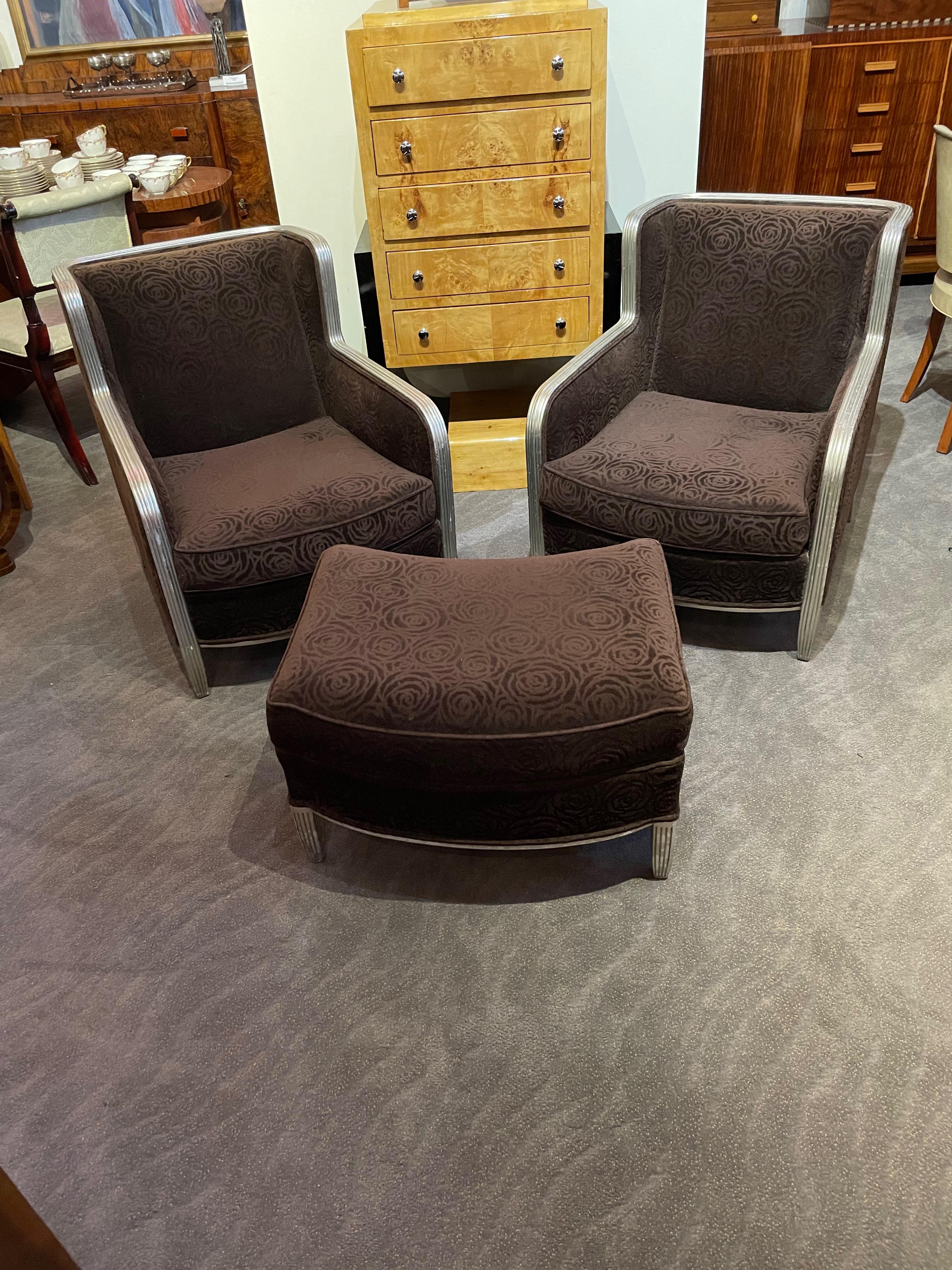 Art Deco Club chairs with footrest and mohair fabric. Newly-made suite with beautiful tone-on-tone mohair in a floral pattern. Great design including the ribbed gilded silver wood outside as the frame. Overall in very good condition with minor wear.