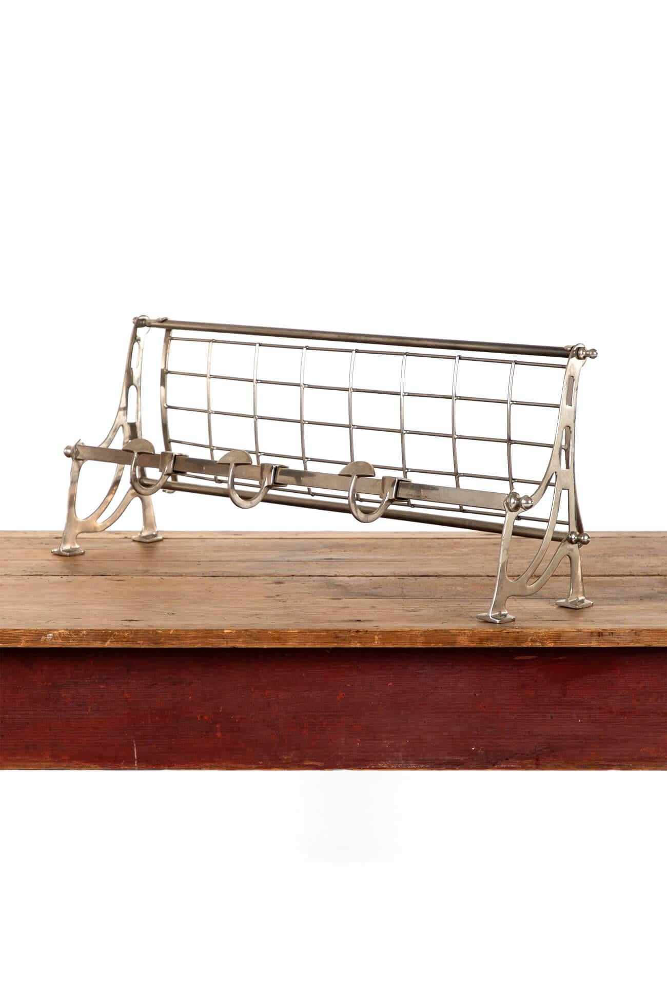 A chrome Art Deco style coat and luggage rack with a sturdy detachable mesh rack over three over sized hooks.

A wonderful piece of timeless design ready for everyday use in the modern world whether that be in your boot room or even the