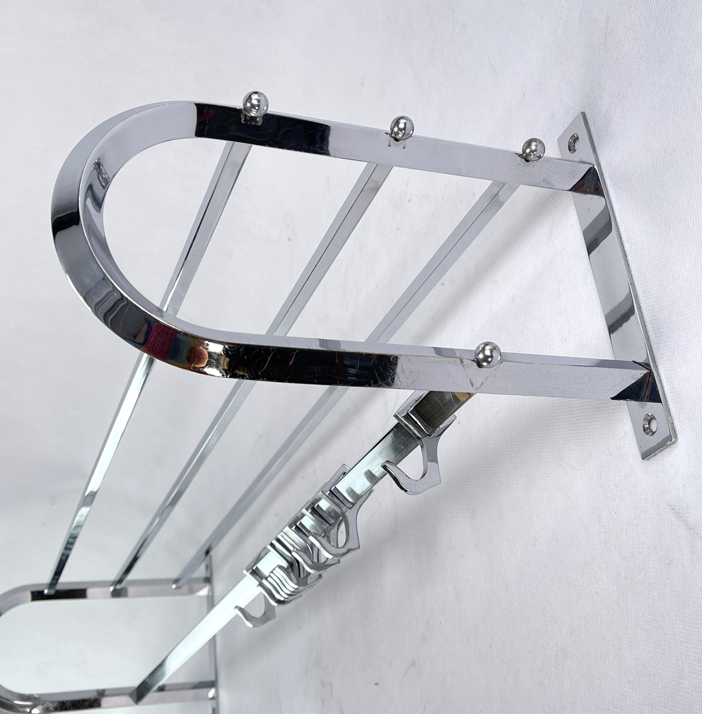 Art Deco wardrobe chrome - 1930s.

This beautiful french wall coat rack from the 1930s is in the streamline modern Art Deco style. This style emphasized curvy streamlined shapes. This is a beautiful, timeless and antique piece that will leave a