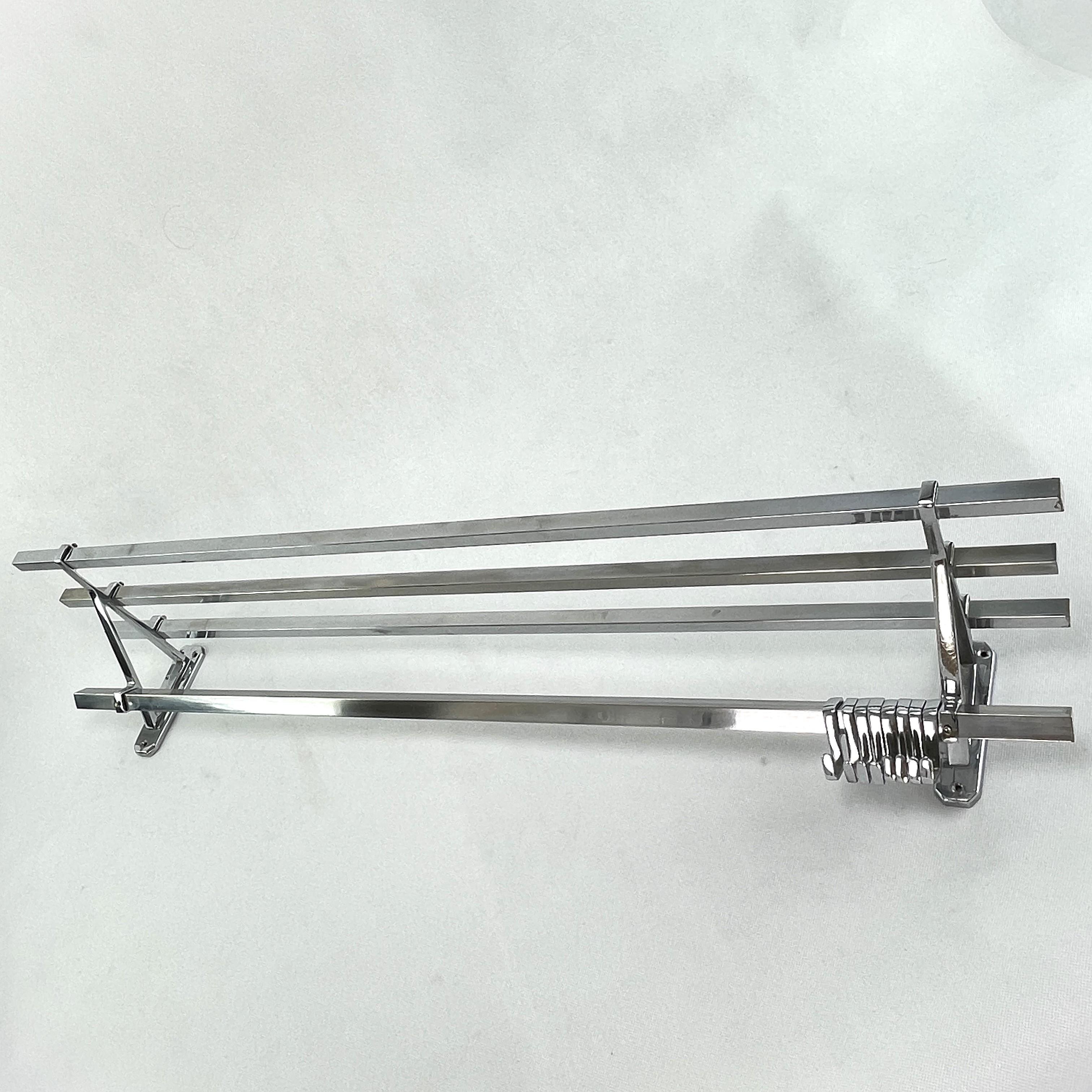 Art Deco wardrobe chrome - 1930s

This beautiful french wall coat rack from the 1930s is in the streamline modern Art Deco style. This style emphasized curvy streamlined shapes. This is a beautiful, timeless and antique piece that will leave a