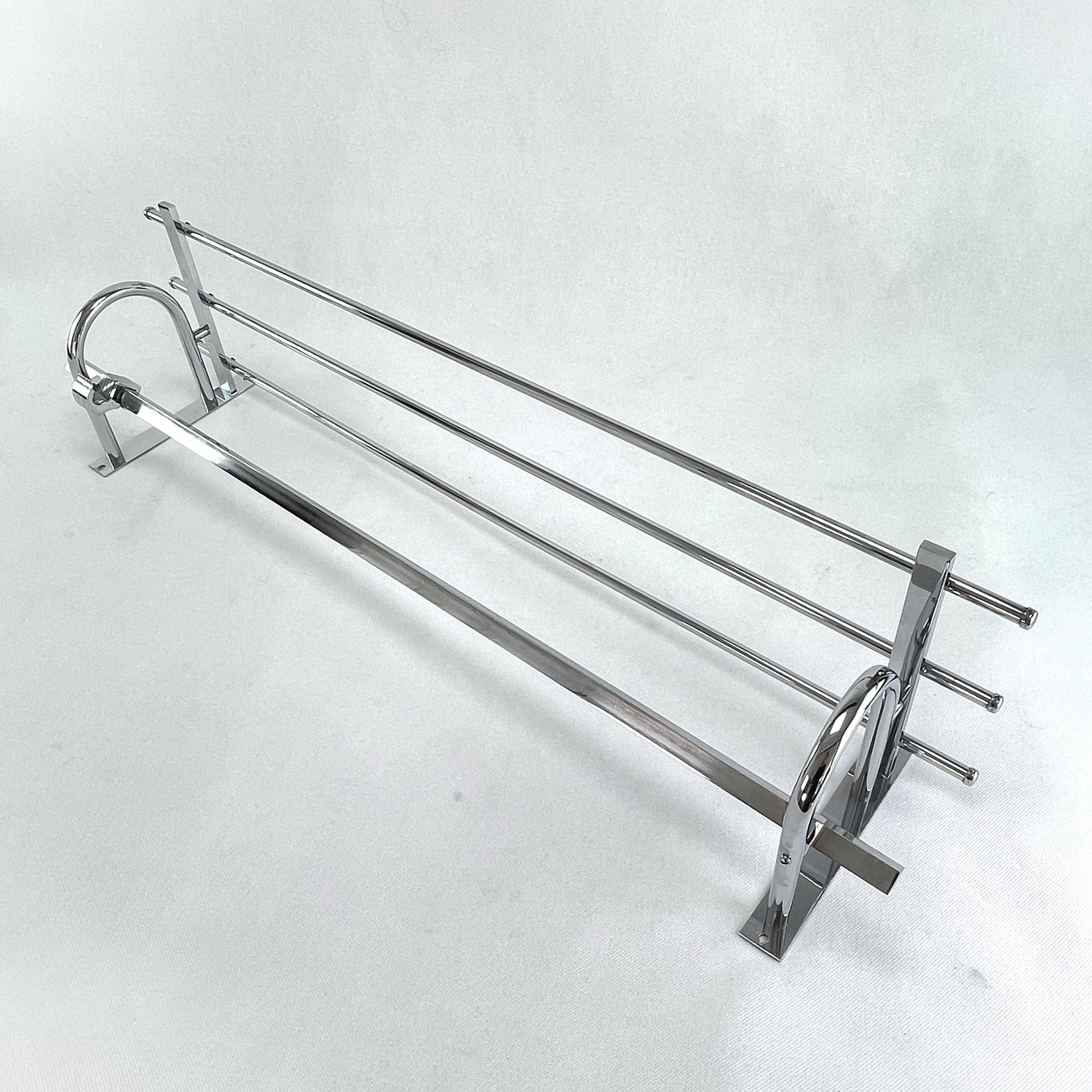 Art Deco wardrobe chrome - 1930s

This beautiful silver french wall coat rack from the 1930s is in the streamline modern Art Deco style. This style emphasized curvy streamlined shapes. This is a beautiful, timeless and antique piece that will