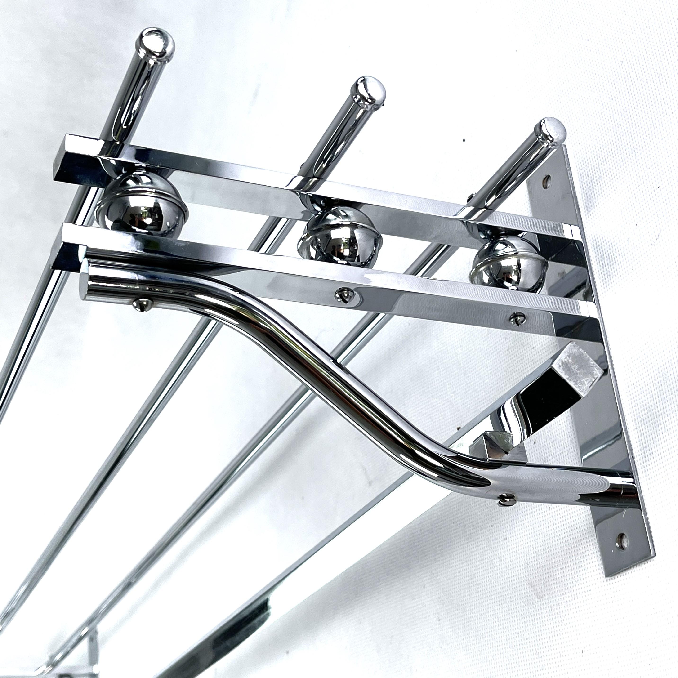 Art Deco wardrobe chrome - 1930s

This beautiful French wall coat rack from the 1930s is in the streamline modern Art Deco style. This style emphasized curvy streamlined shapes. This is a beautiful, timeless and antique piece that will leave a