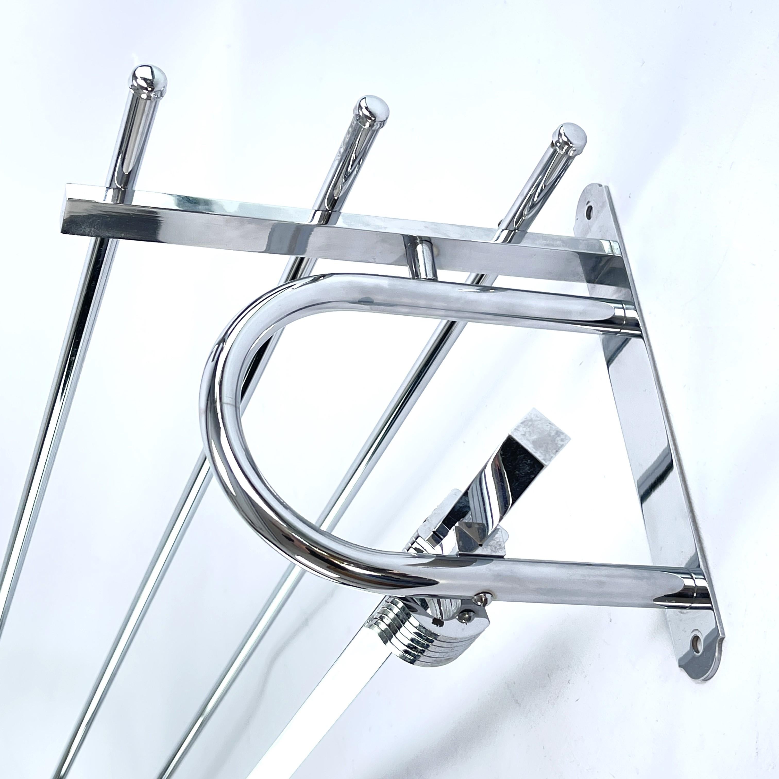 Art Deco wardrobe chrome - 1930s

This beautiful French wall coat rack from the 1930s is in the streamline modern Art Deco style. This style emphasized curvy streamlined shapes. This is a beautiful, timeless and antique piece that will leave a
