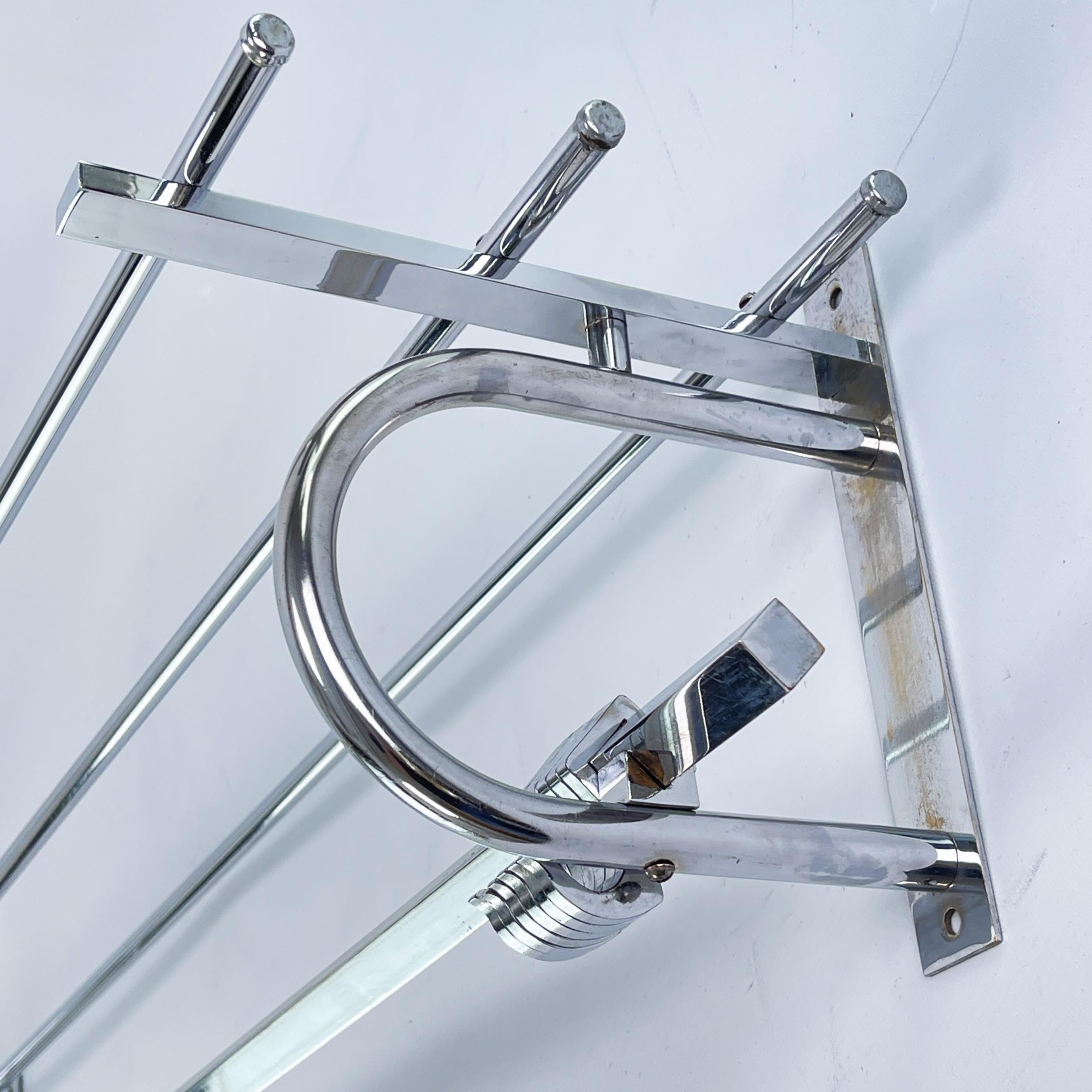 Art Deco wardrobe chrome - 1930s

This beautiful French wall coat rack from the 1930s is in the streamline modern Art Deco style. This style emphasized curvy streamlined shapes. This is a beautiful, timeless and antique piece that will leave a