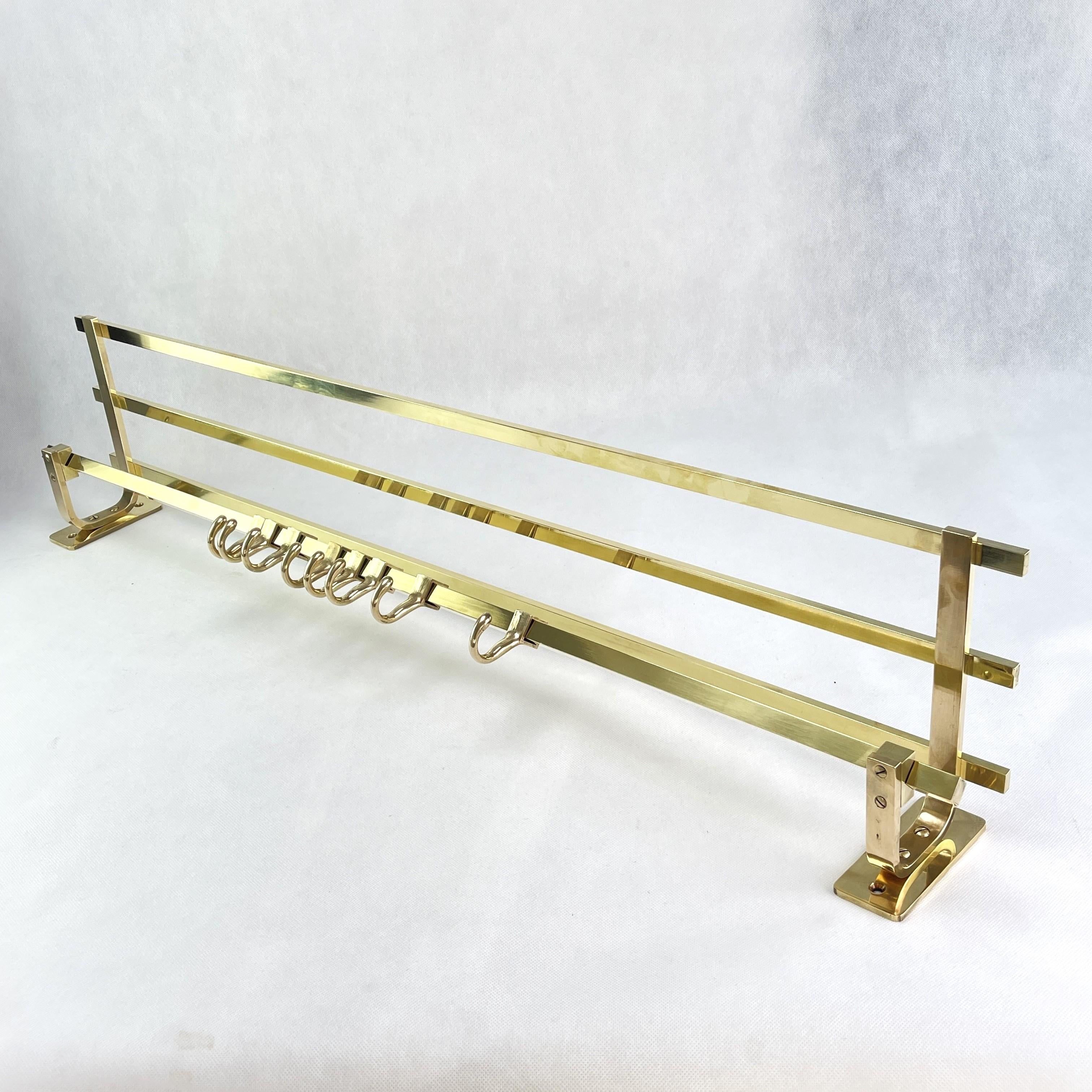 ART DECO Wall Coat Rack Gold Brass 1930s

This unique coat rack combines nostalgic charm with practical functionality and adds a touch of timeless elegance to your entrance area. The 8 movable hooks give you the freedom to adjust the positions