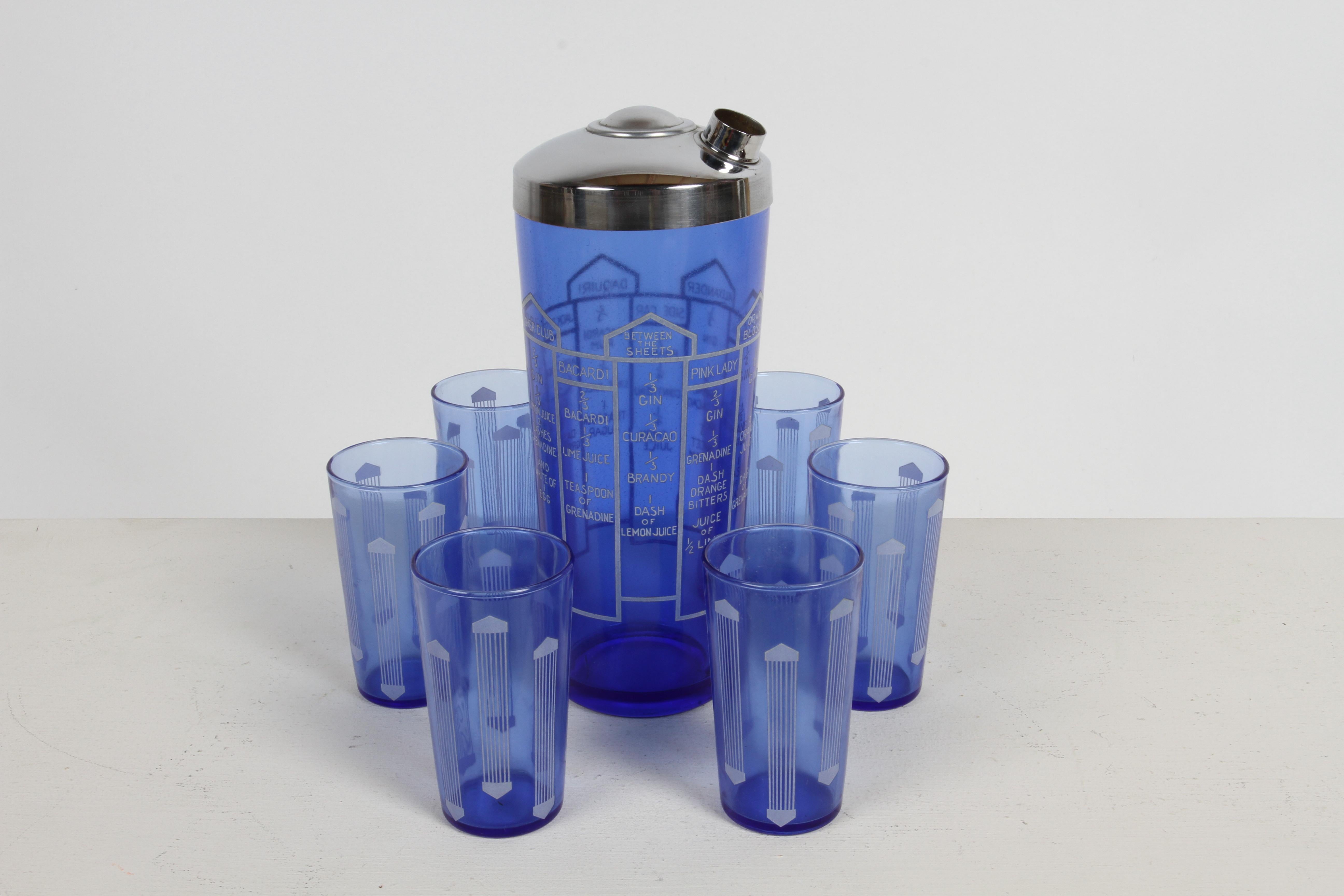 Classic Art Deco cobalt blue glass shaker cocktail with 10 classic recipes and six matching bar glasses. Recipes printed in white, for drinks Orange Blossom, Bronx, Alexander, Side Car, Daquiri, Jack Rose, Clover Club, Between the Sheets, Bacardi