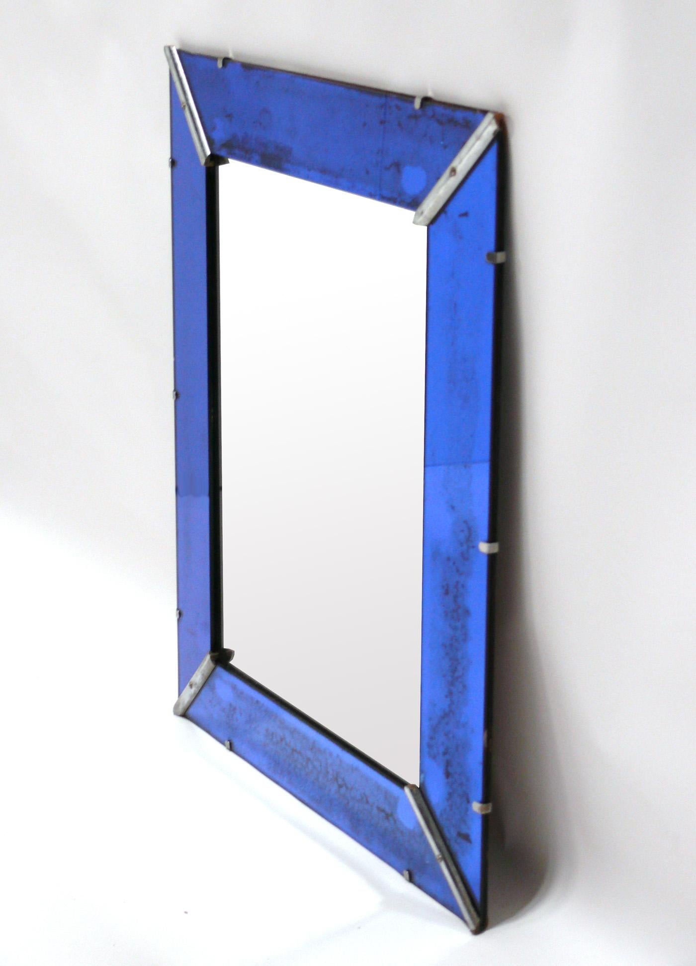 Art Deco Cobalt Blue mirror, American, circa 1930s. It retains it's wonderful original distressed patina to both the cobalt mirror frame and the original silvered mirror center panel.