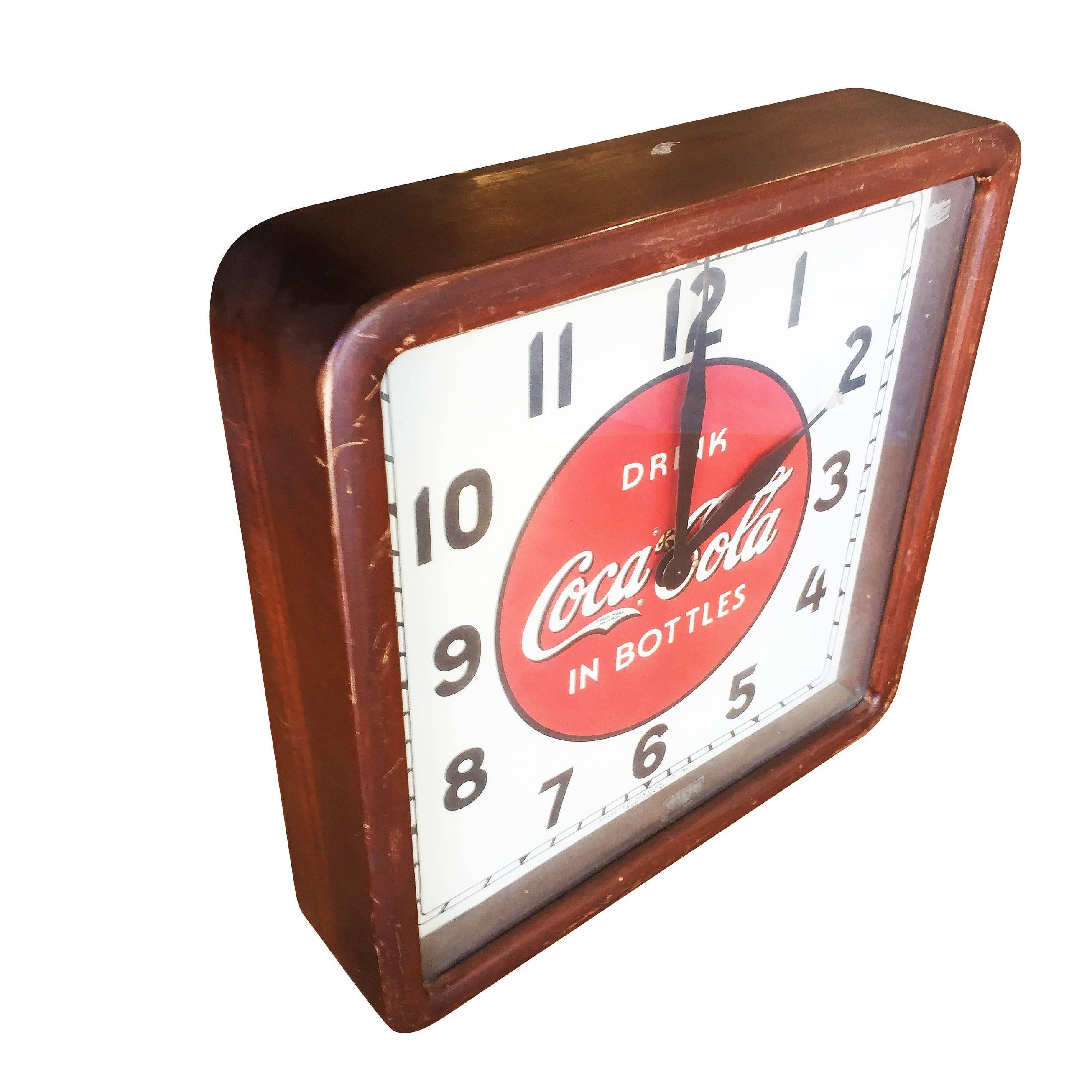 1939 Coca-Cola wood frame wall clock by Selected Devices New York, NY

Clock’s face, hands and wooden frame are totally original and intact but the movement has been replaced with a quartz battery operated one. Measures 16