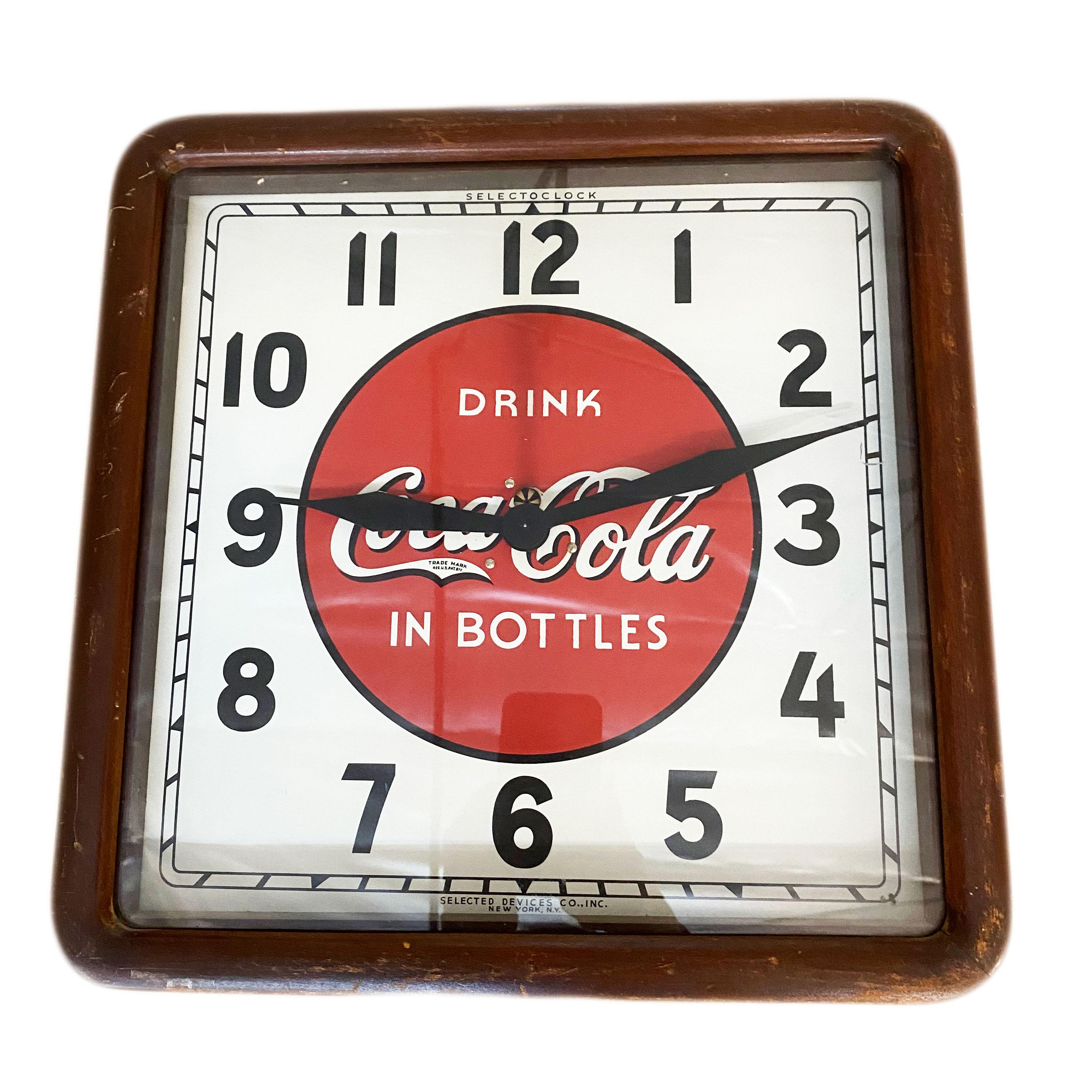 1939 Coca-Cola wood frame wall clock by Selected Devices New York, NY

Clock’s face, hands and wooden frame are totally original and intact but the movement has been replaced with a quartz battery operated one. Measures 16