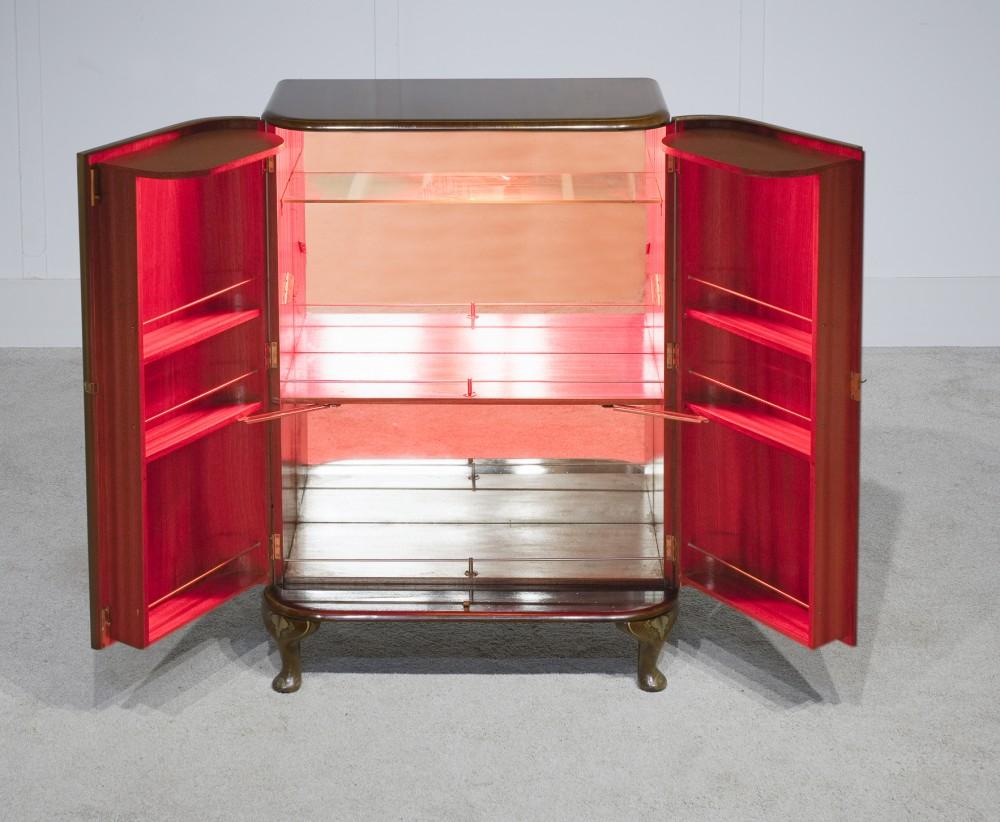 Glorious period art deco cocktail cabinet decorated with profuse Chinoiserie
Originally retailed by Harrods of London, please see close up photo of factory stamp
Great piece of unique period art deco
Piece opens up to reveal glass lined interiors