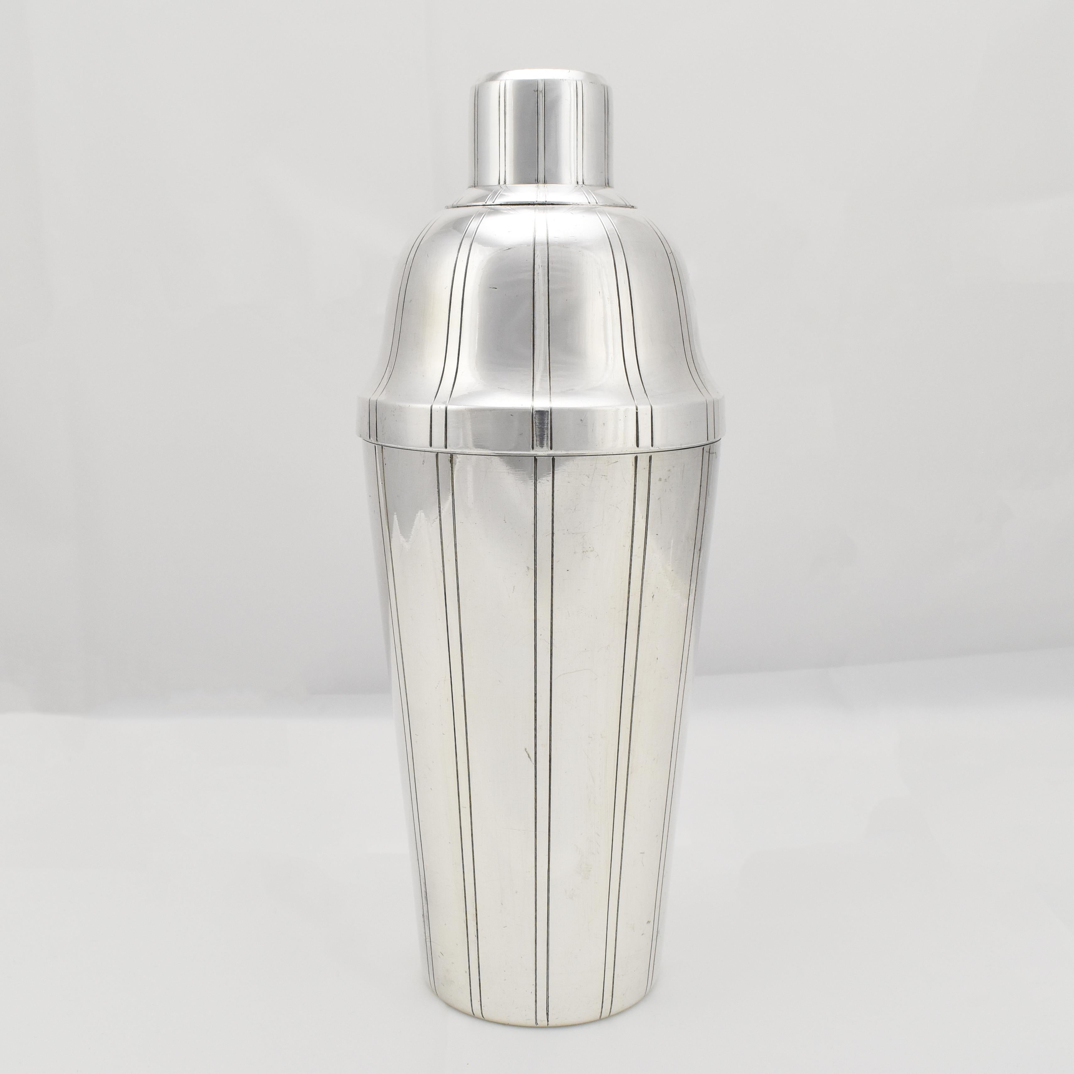 This vintage cocktail shaker is a pure and elegant designed piece, crafted from silverplated brass by the well-known French manufacturer Charles Boulenger.

The shape features clean lines with a well-proportioned silhouette with minimalist incised