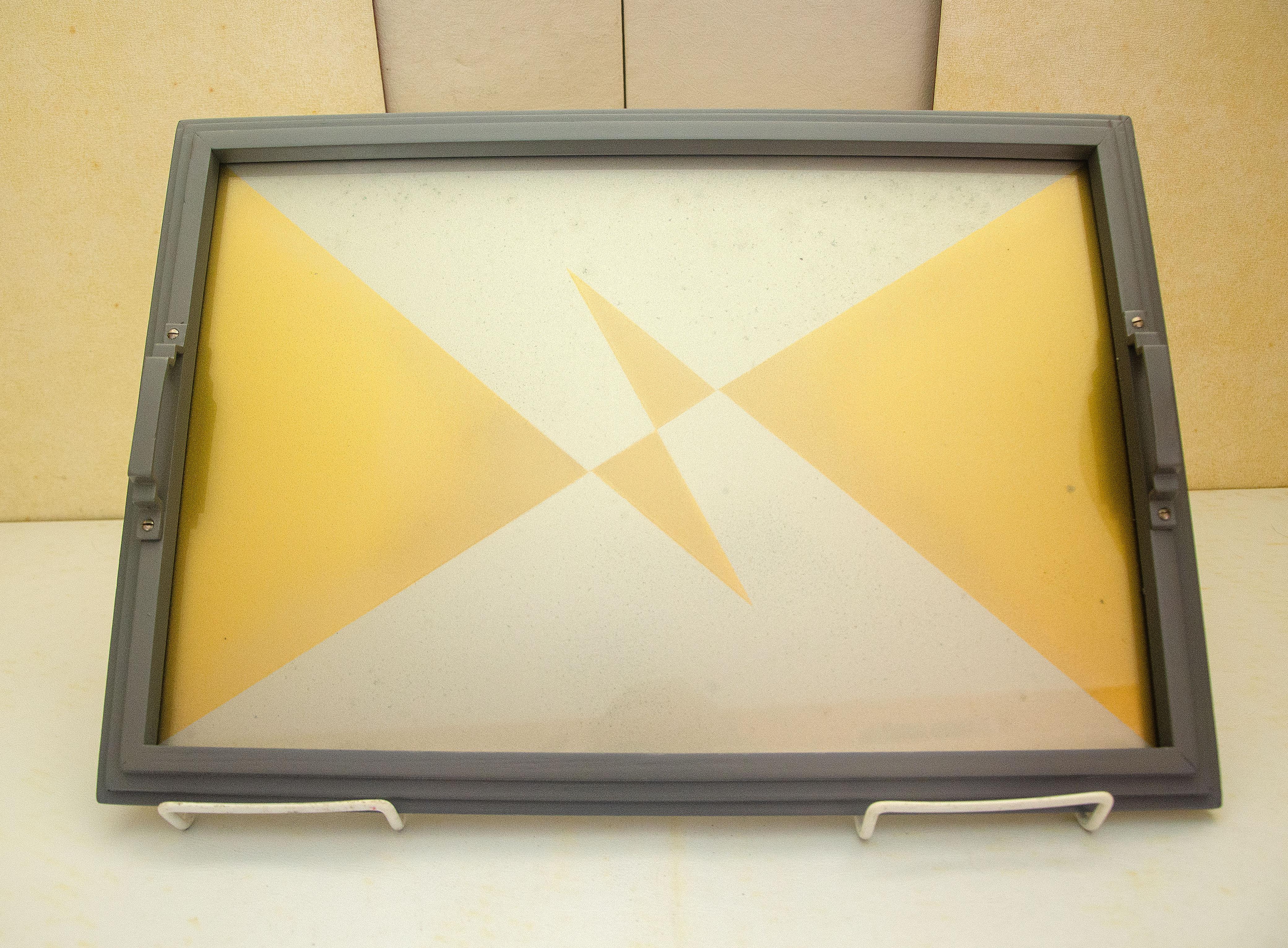 Unusual gold and silver/gray Art Deco geometric graphic design in a restored silver/gray stepped frame with handles. The tray serving space is 15 1/2' x 10 1/4