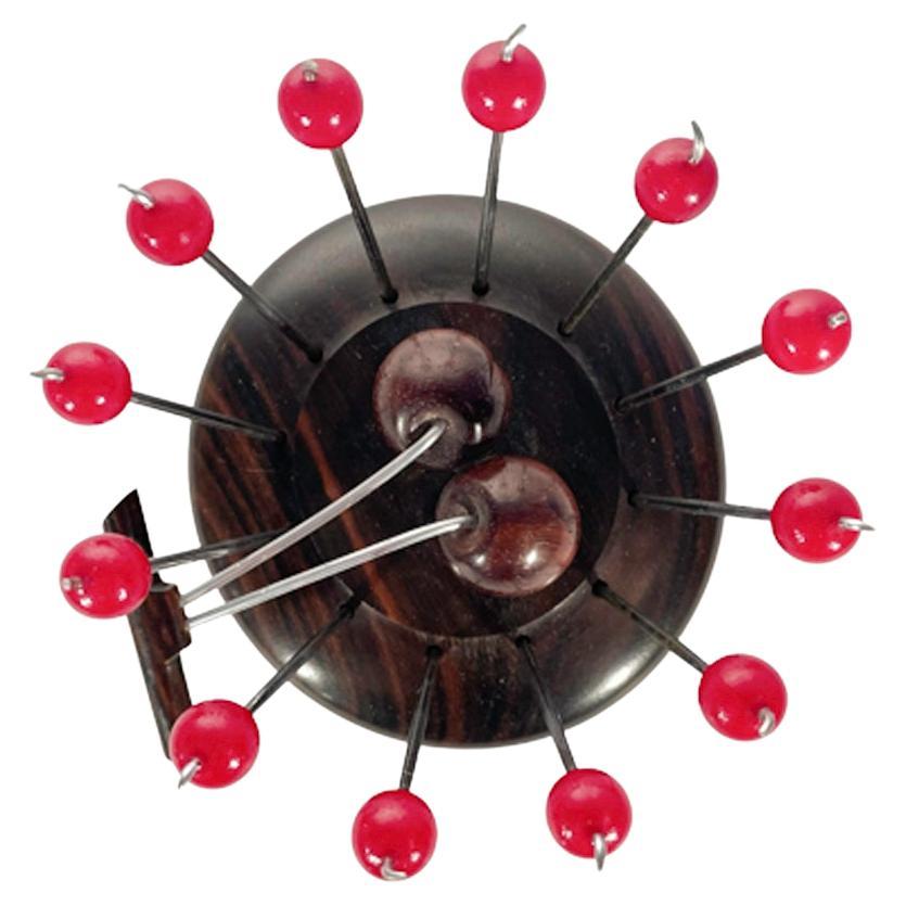 French Art Deco cocktail pick set with 12 red cherry topped chrome picks standing in a turned wood base with 2 carved wood cherries.