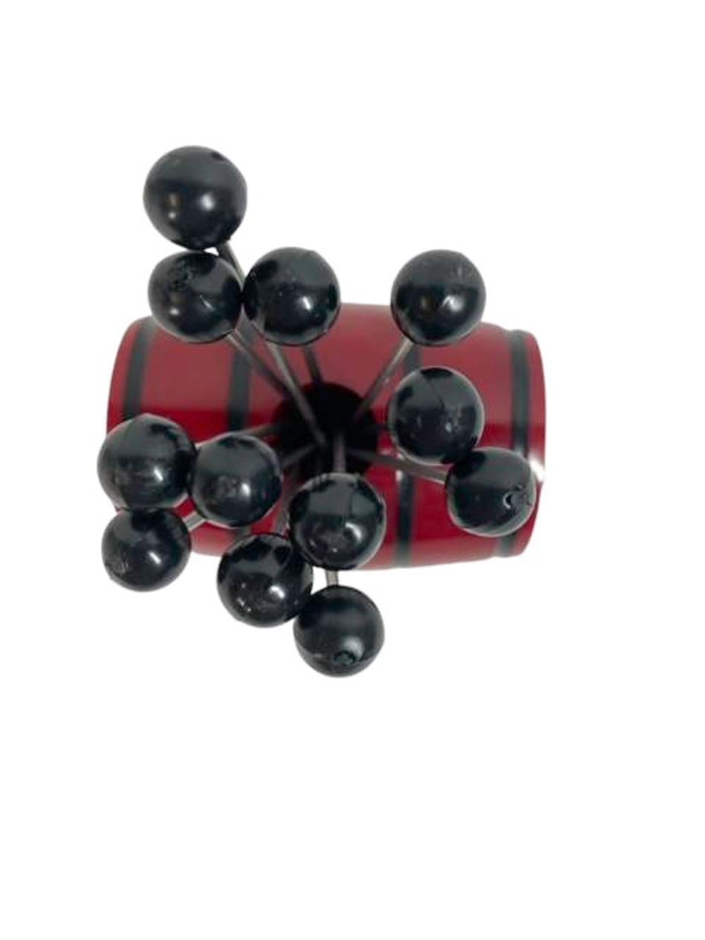 20th Century Art Deco Cocktail Picks, 12 Picks in a Red Bakelite Keg-Form Holder For Sale