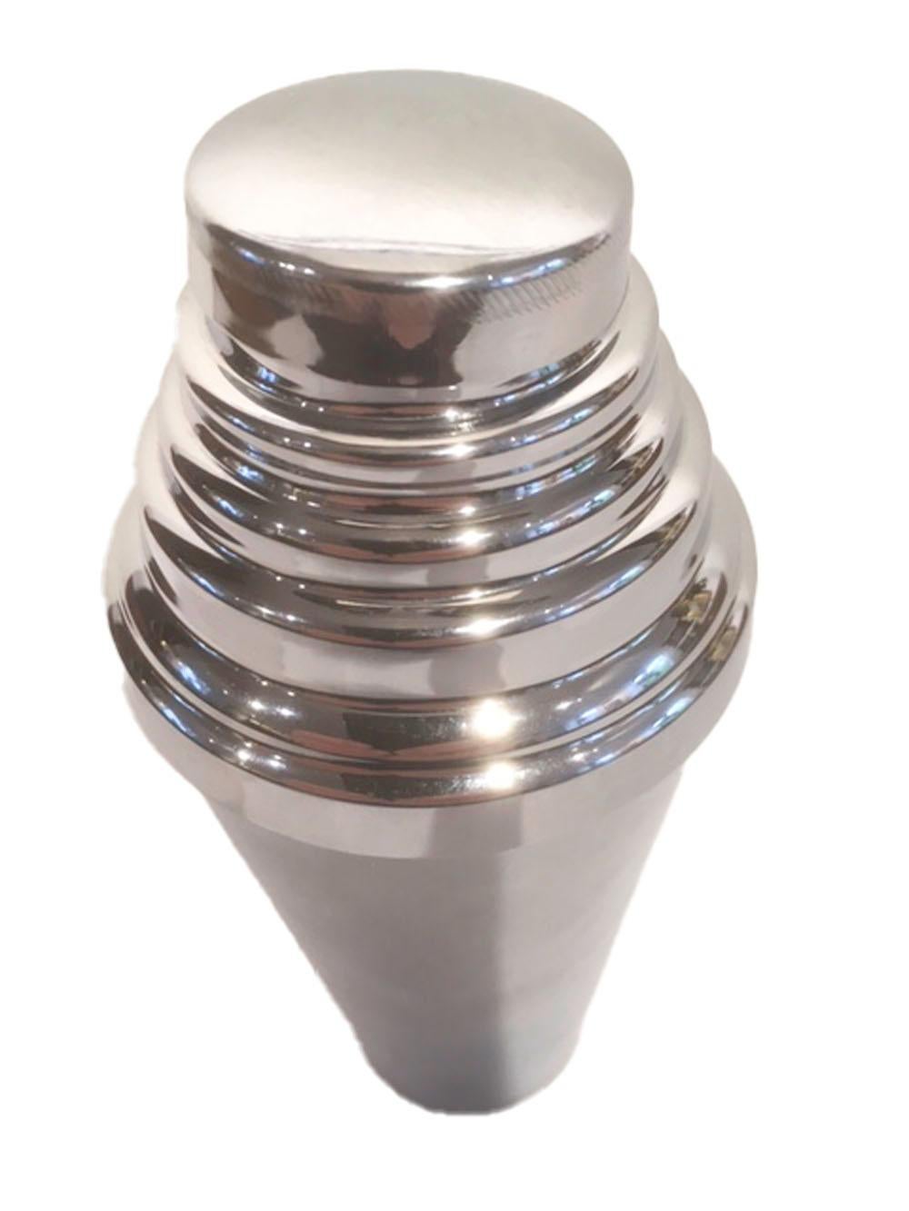 Sleek vintage chrome cocktail shaker by Glo-Hill with a slightly tapered body topped by a stepped lid. The lid is double-walled with fitting the inside and the other over hanging the outside of the base, the lid is topped with a built-in strainer