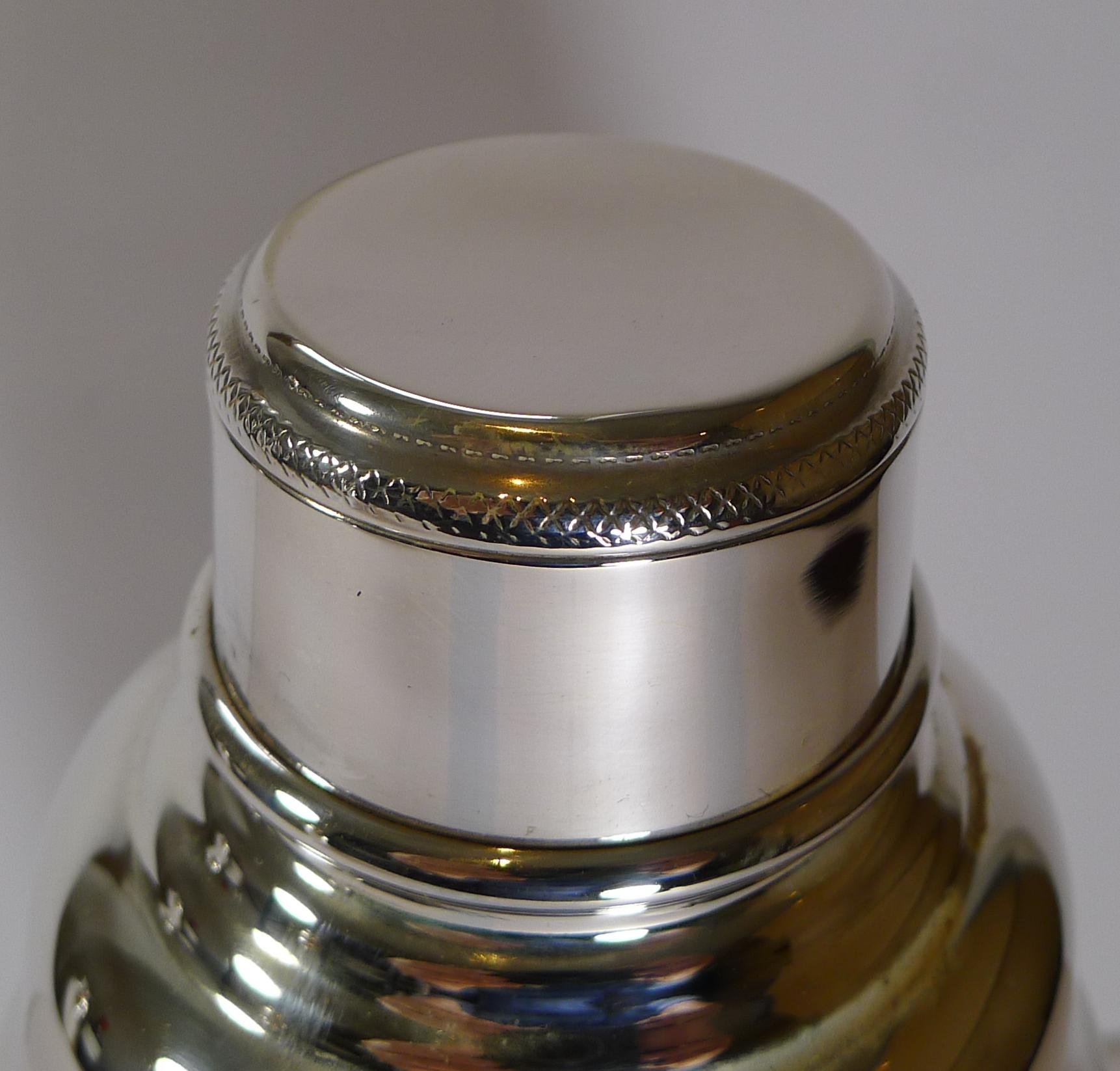 A good sized silver plated cocktail shaker by the highly collectable silversmith, Hukin and Heath.

Just back from our silversmith's workshop where it has been professionally cleaned and polished, restoring it to it's former glory.

Art Deco in