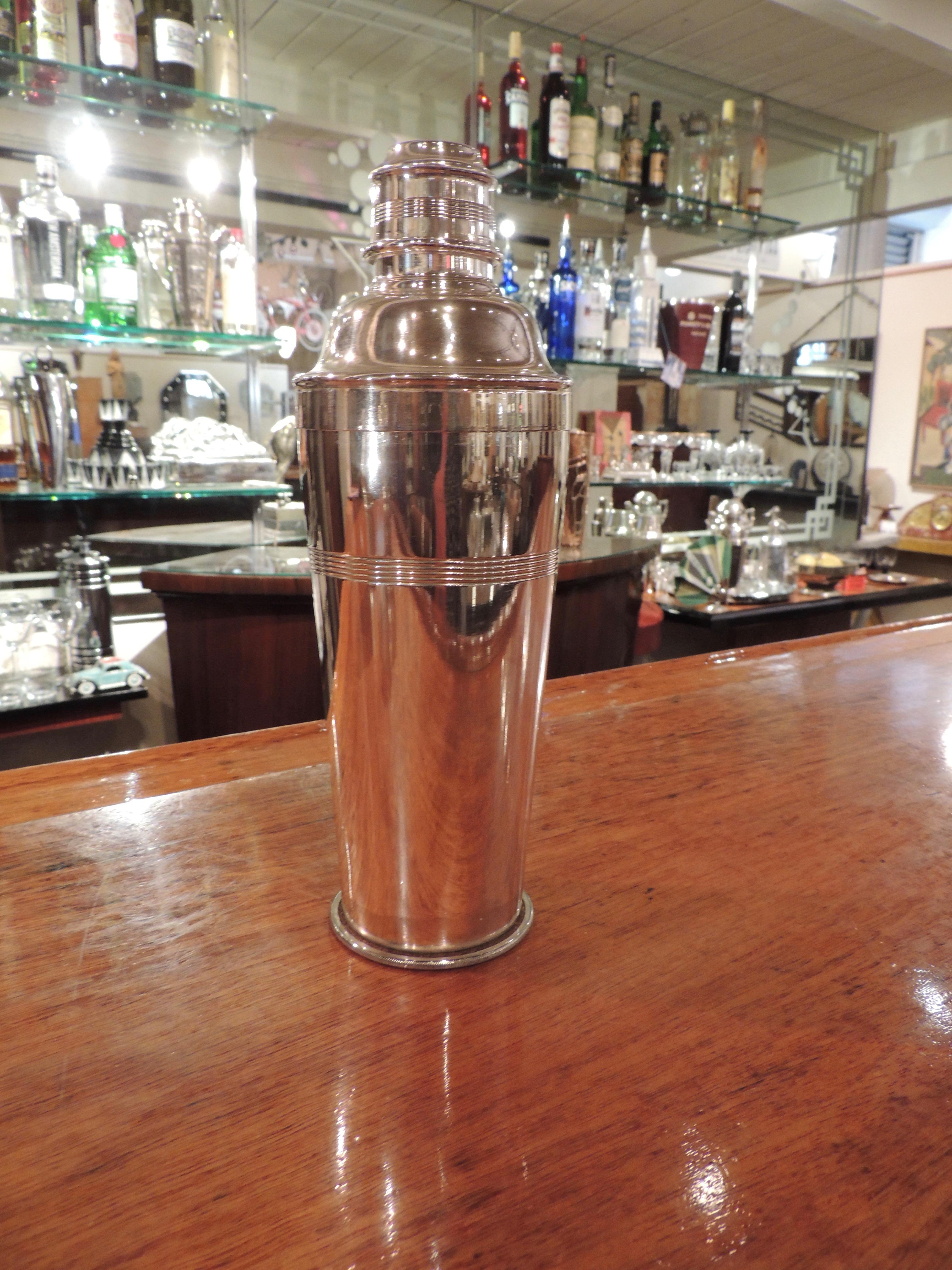 The silver plated ”Igene” Cocktail Shaker is an ingenious invention that has a built in compartment that holds ice inside the shaker. Created by Farrow and Jackson, mechanical engineers that began producing equipment used in the production and sales