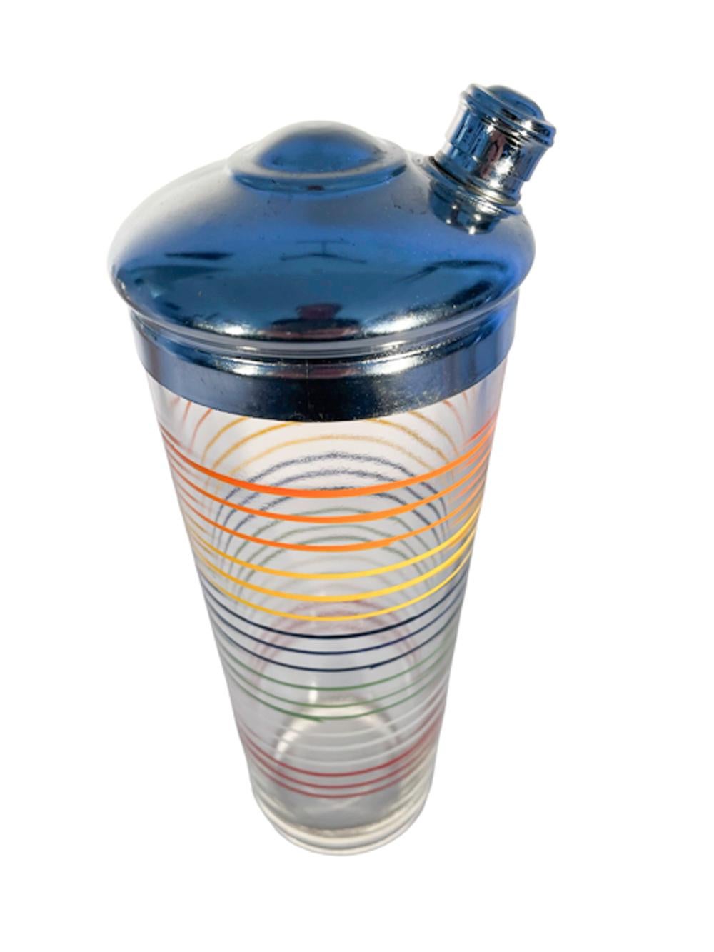 Art Deco glass cocktail shaker with chrome top and decorated in six colors comprising bands of three lines each. These 'racing stripes' were most likely a result of the popularity of the emerging automobile industry and the machine age design which