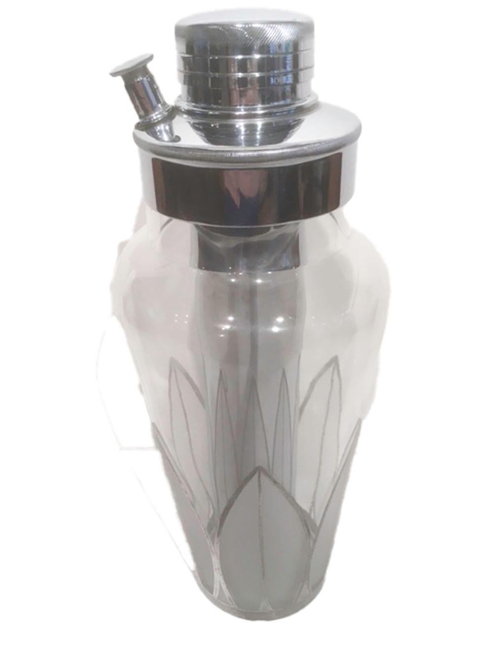 Vintage cocktail shaker of clear glass decorated on the lower half with palmettes of frosted fronds outlined with sterling overlay. The chrome lid has an attached ice reservoir which extends to the base of the shaker and reflects the palmettes as