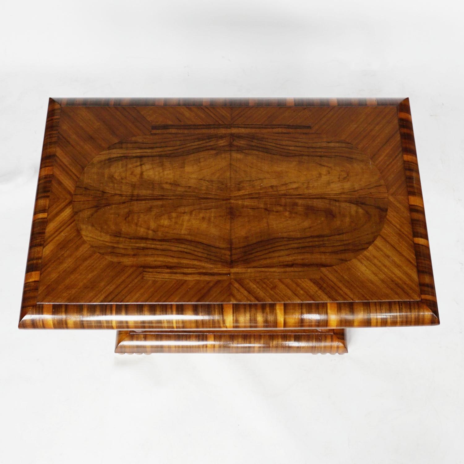An Art Deco coffee/occasional table. Burr walnut and Macassar ebony veneer throughout set over four square pad feet.

Dimensions: H 62cm, W 84cm, D 54cm 

Origin: English

Date: Circa 1935

Item number: 1905212

All of our furniture is