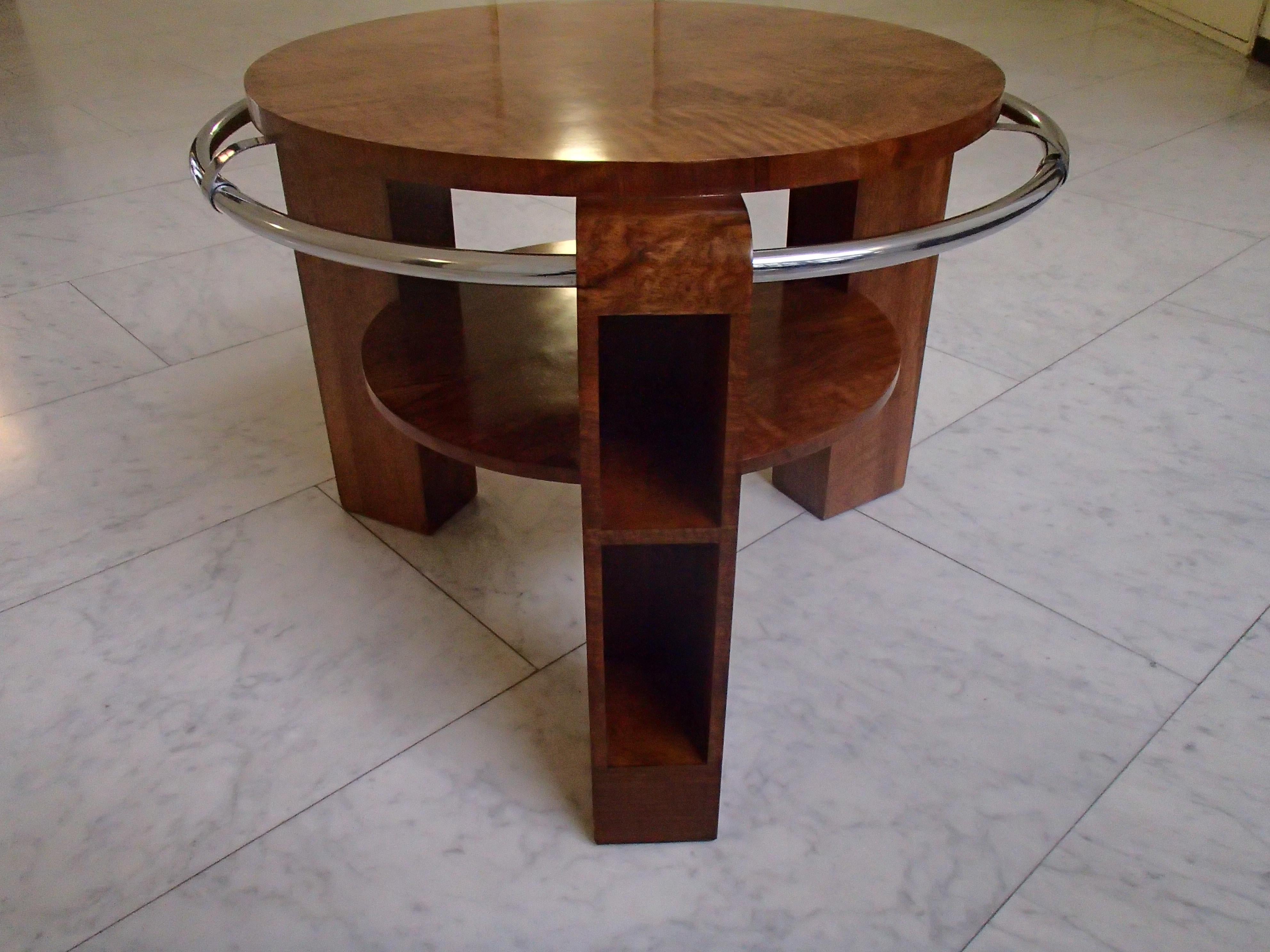 Art Deco coffee or sofa table walnut with chrome ring and shelf's in the legs completely restored
with shellac.