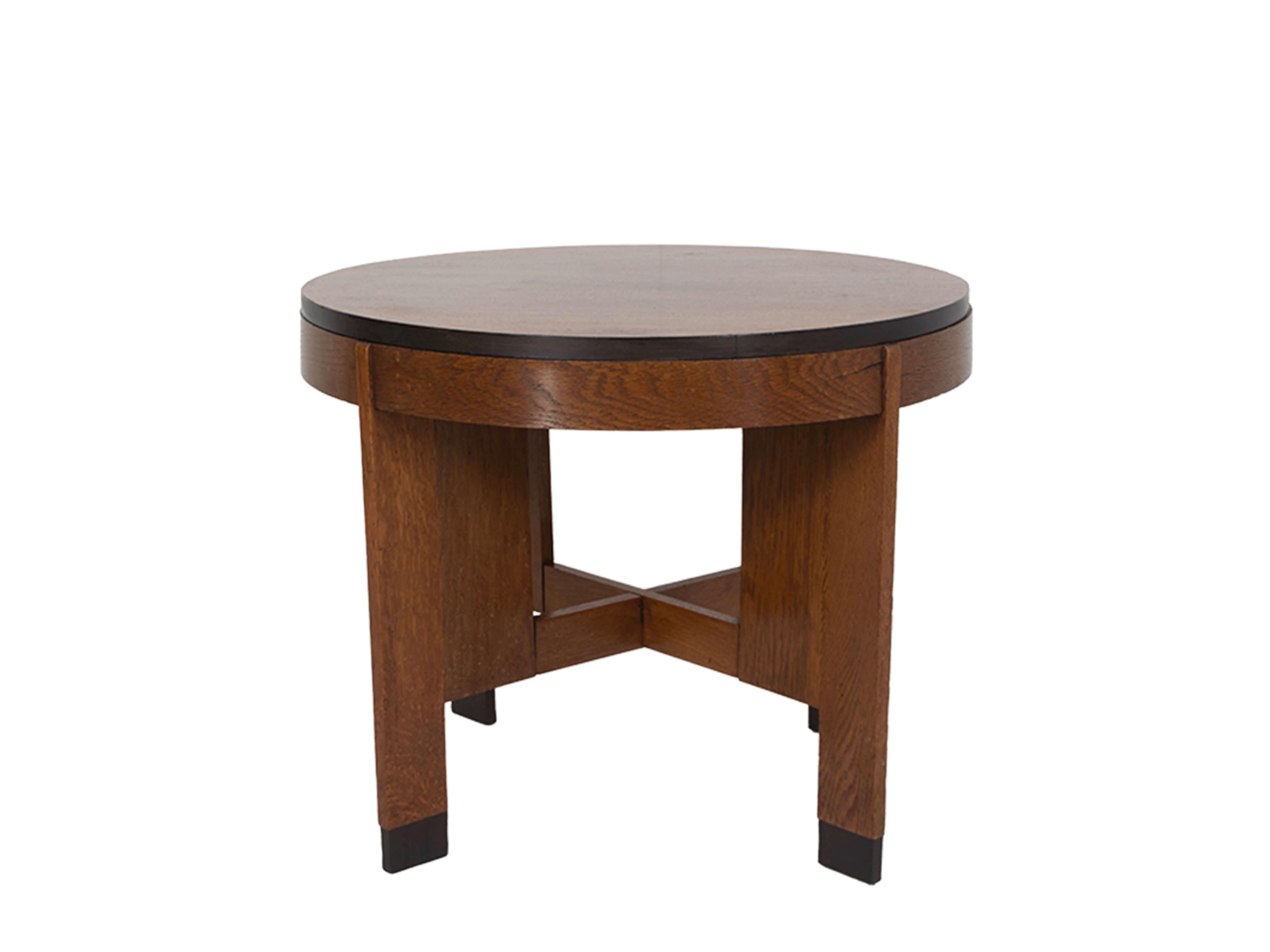 Nice Art Deco coffee table in Amsterdam School style from The Netherlands, 1930s. This table is made of oak, very functional and has an attractive shape. The lines of the feet are impressive and give the table another look everytime you look at it.