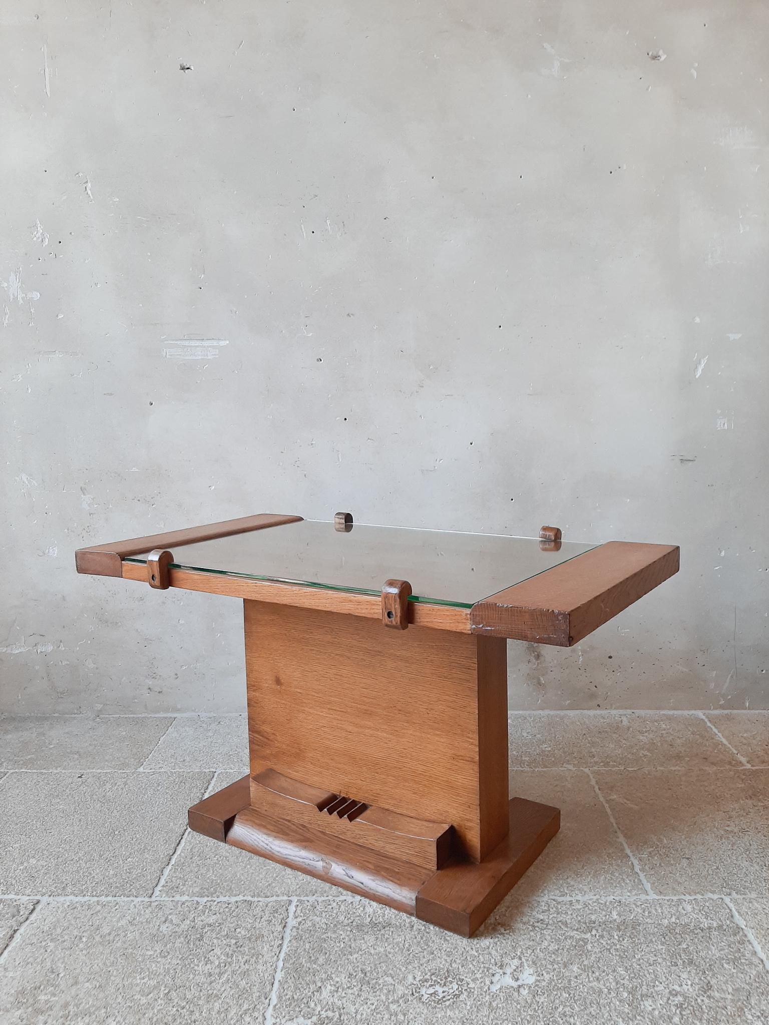 Coffee table by Charles Dudouyt, made from oak wood with a glass top. A modernist Art Deco lounge table from the 1940s. Can also be used as side table. 

Measurements:

H 48 x W 85 x D 45 cm.
