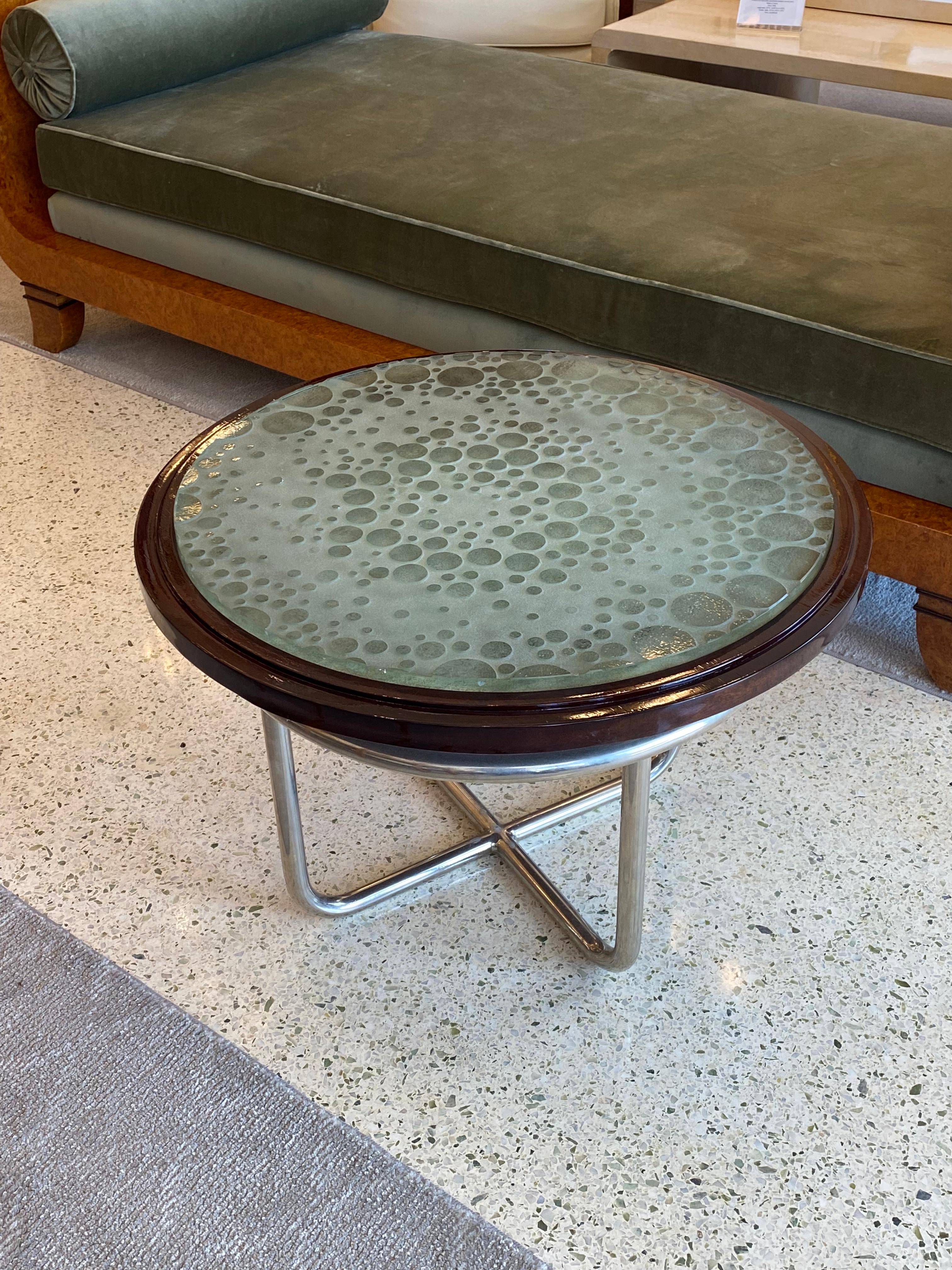 Art Deco Maurice Dufrene modernist coffee table with nickel metal legs and glass top designed by Max Ingrand.
Made in France. 
Circa: 1930.