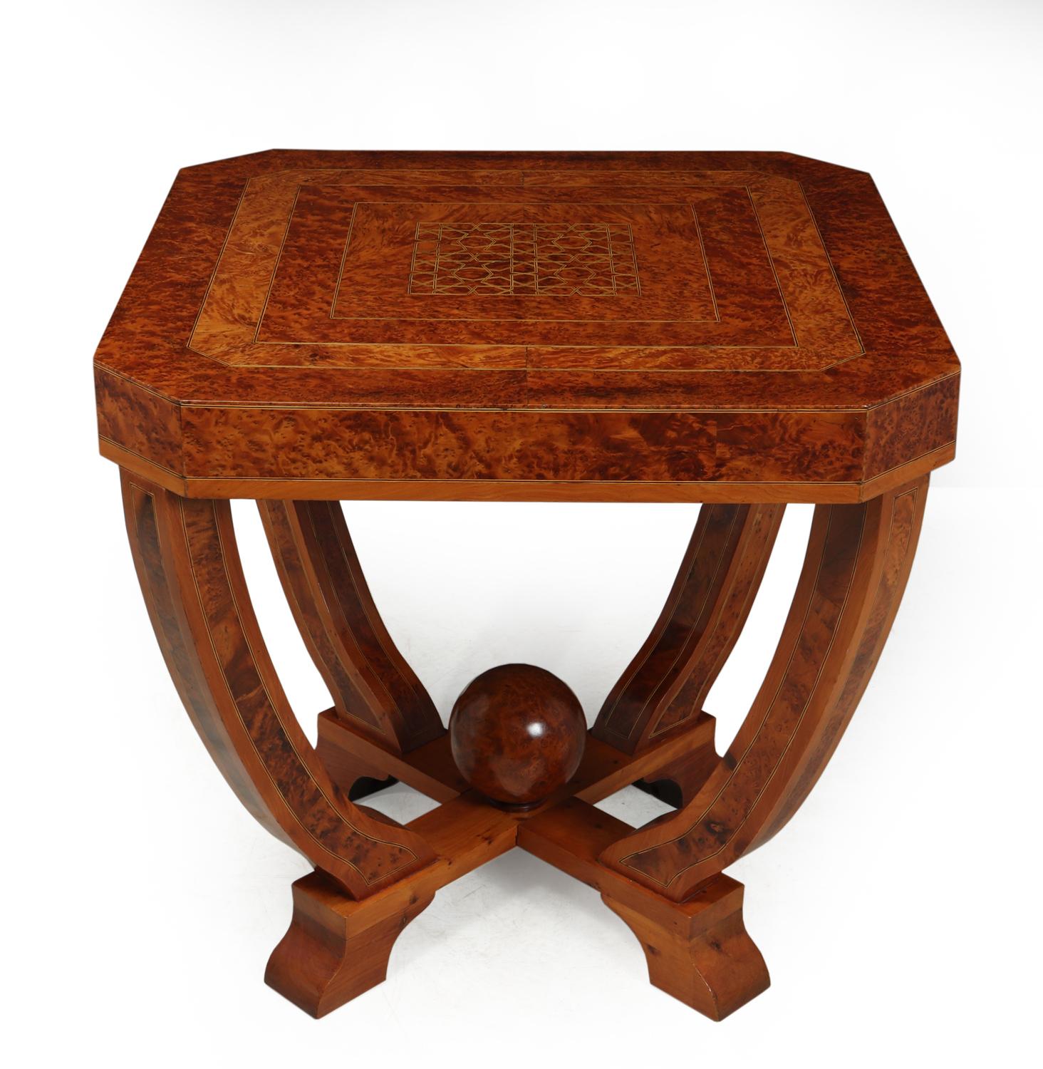 Art Deco coffee table in burr yew circa 1930
An exceptional quality table produced in solid Yew and inlaid in burr Yew with boxwood and ebony stringing, the central ball is a solid turned burr, the table is in excellent condition having been fully