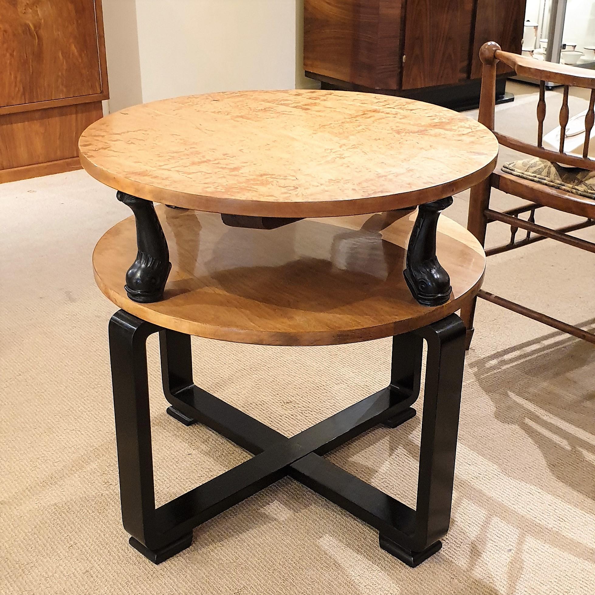 An original Art Deco circular coffee or occasional table

Two-tier design in satin birch with ebonised Dolphins

Possibly French, circa 1935-1955.



 