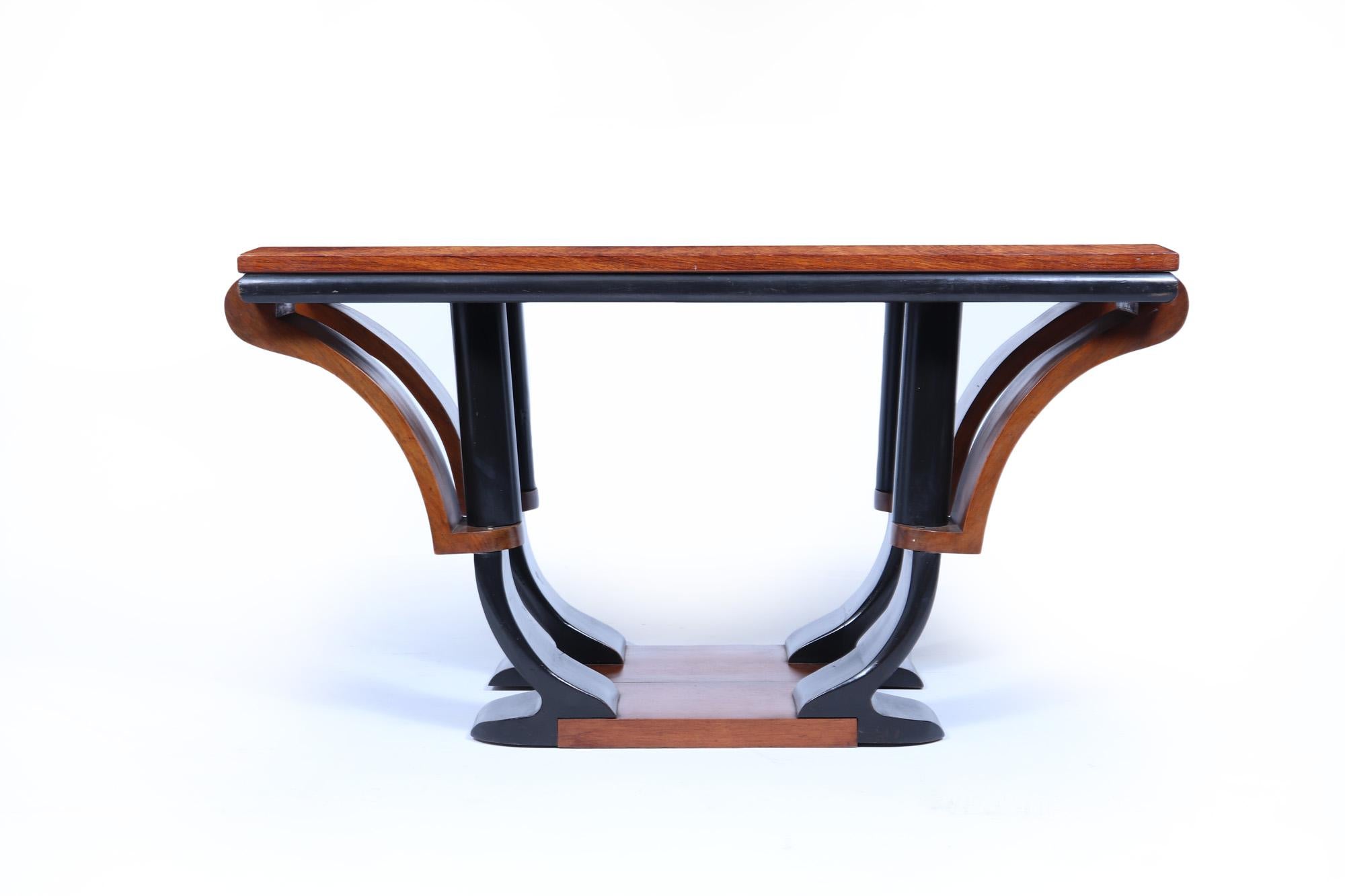 Art Deco Coffee Table 
A lovely rare coffee table produced in solid walnut in France in the 1920’s, having a very stylish part ebonised base the table has been part polished and in very good condition with some very minor age related use.

Age: