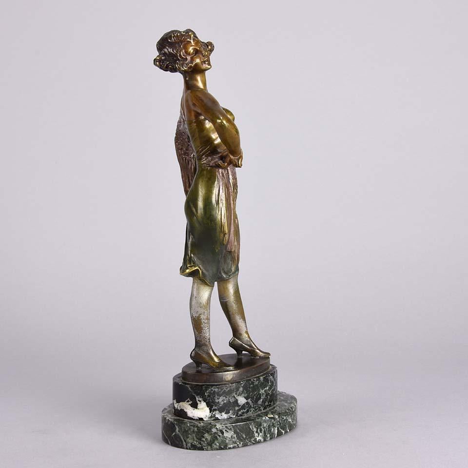 A fabulous Art Deco cold painted bronze figure of an erotic beauty standing in an authoritative pose, exhibiting excellent colour and very fine hand finished detail, raised on an onyx base and signed Zach

Bruno Zach (German, 1891 – 1935) - Bruno